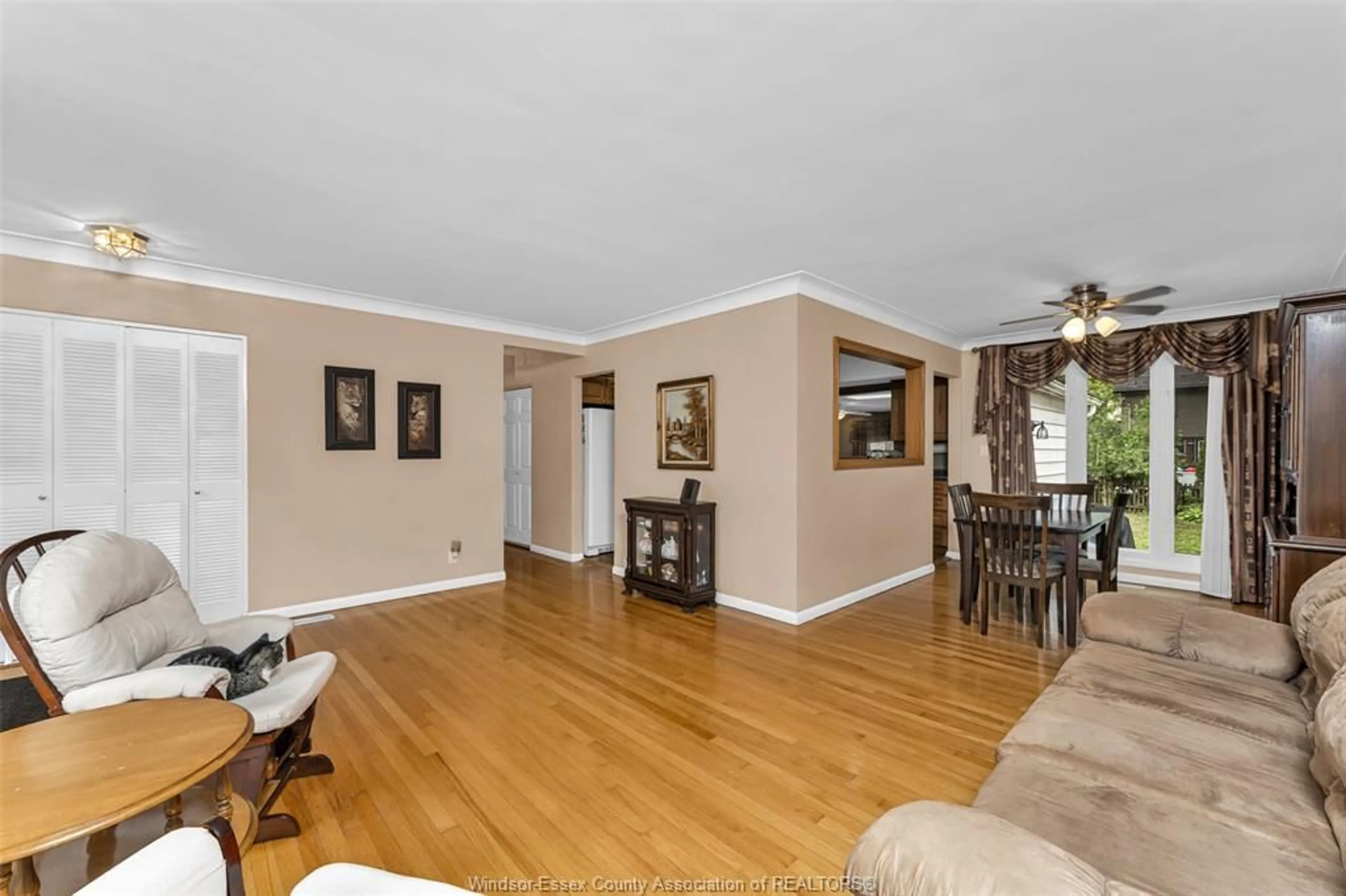 Living room with furniture, wood/laminate floor for 3415 RANDOLPH, Windsor Ontario N9E 3E9