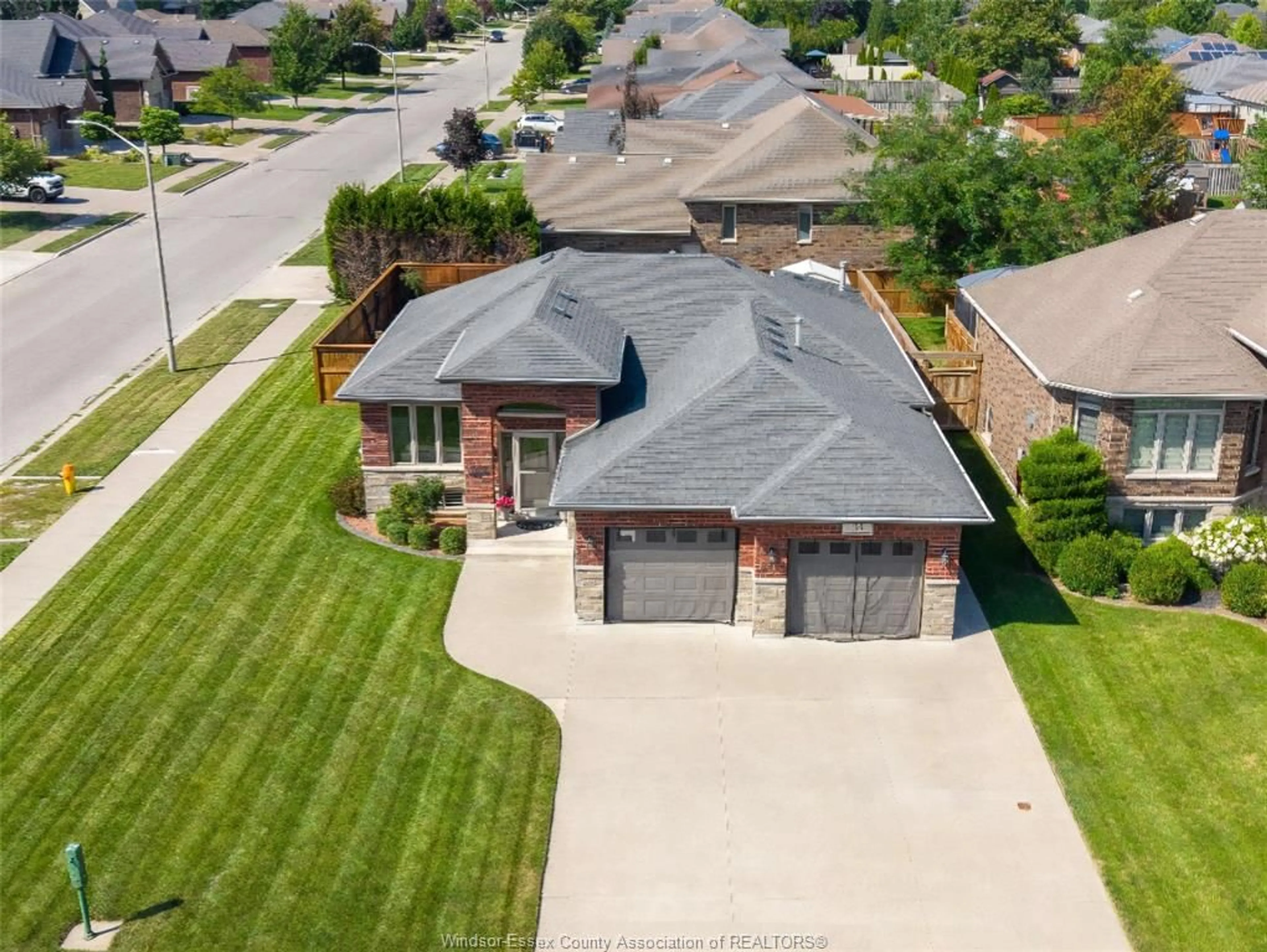 A pic from outside/outdoor area/front of a property/back of a property/a pic from drone, street for 35 MARSHWOODS Blvd, Kingsville Ontario N9Y 0A7