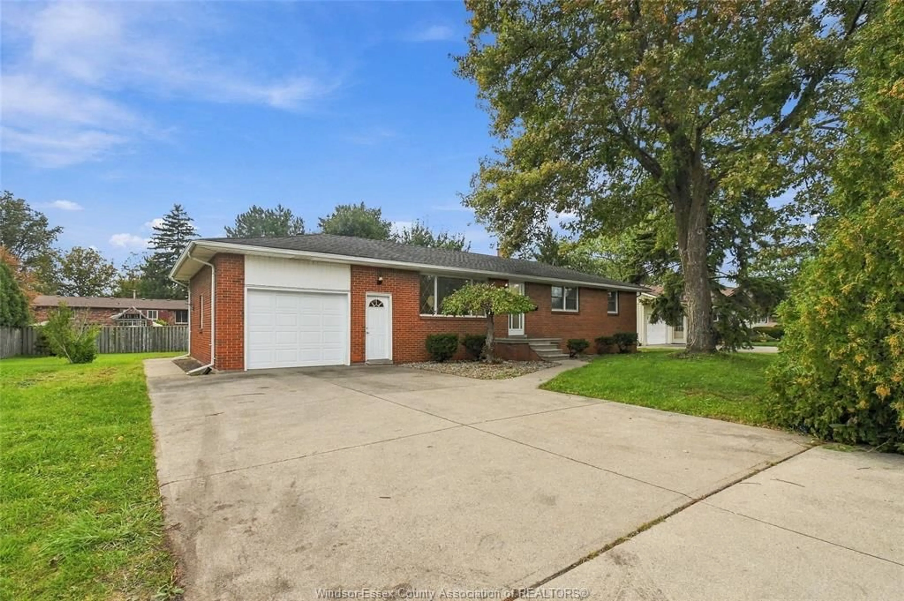 Home with brick exterior material, street for 4045 DOUGALL Ave, Windsor Ontario N9G 1X4