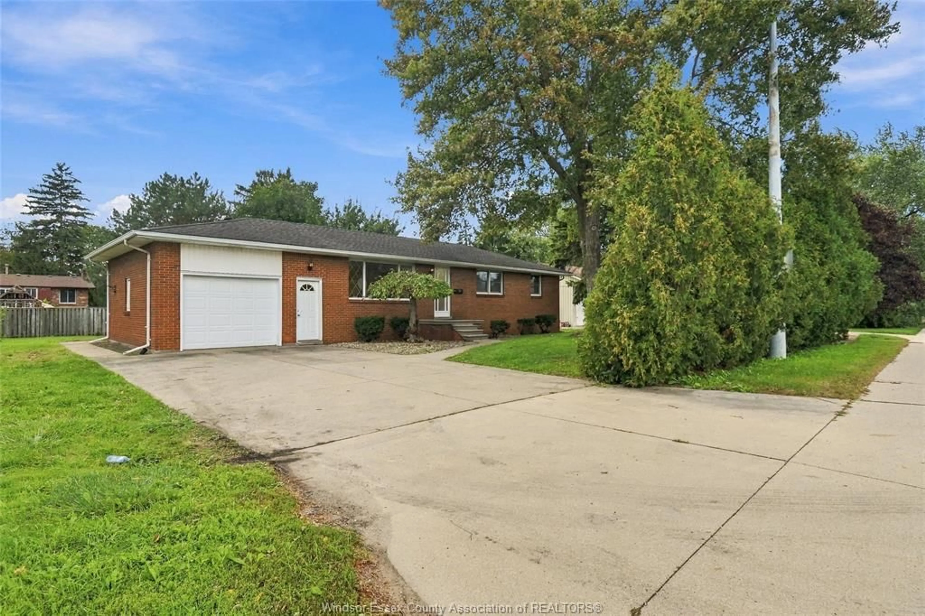 Home with brick exterior material, street for 4045 DOUGALL Ave, Windsor Ontario N9G 1X4