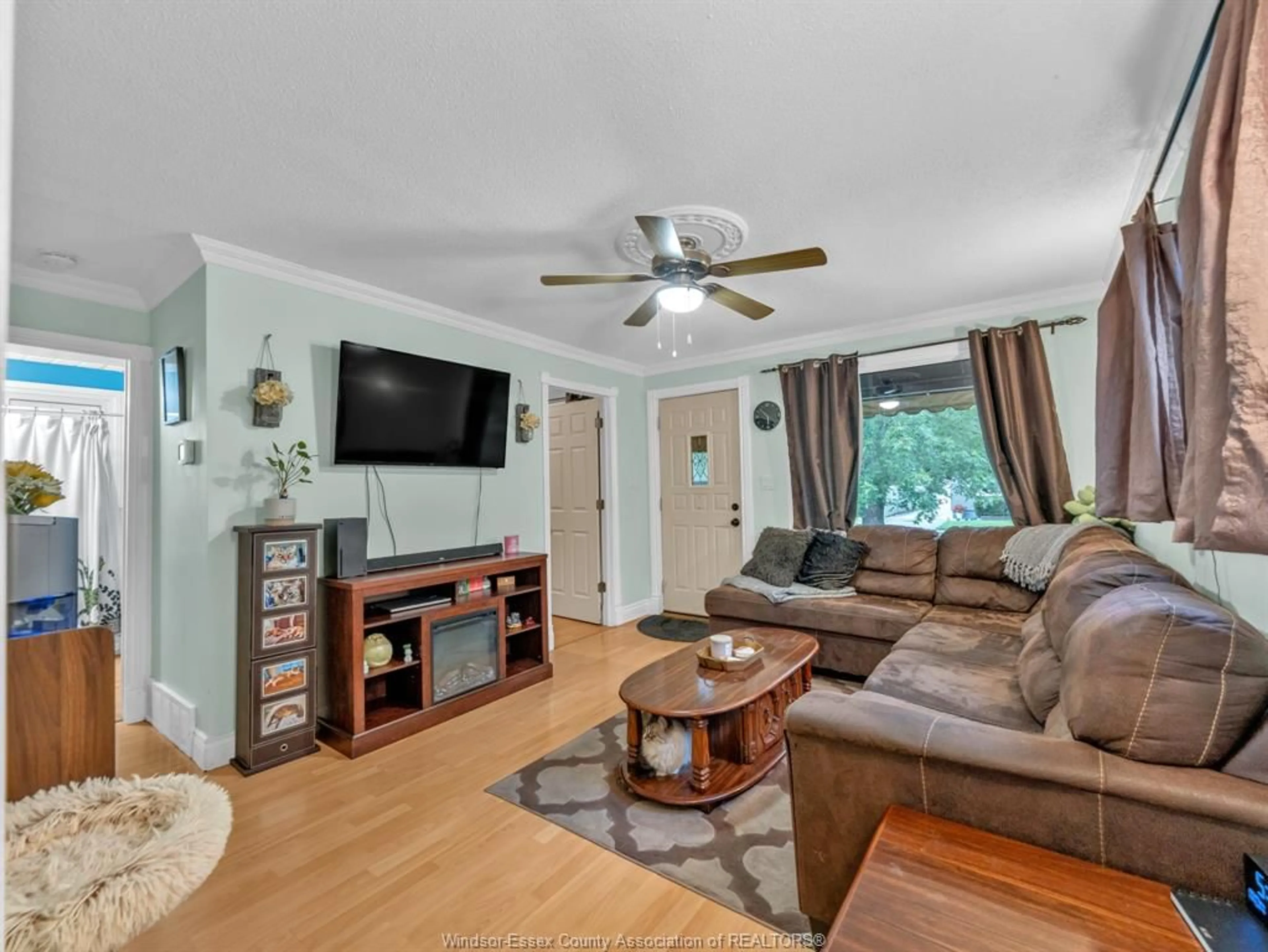 Living room with furniture, wood/laminate floor for 1826 FRANCOIS Rd, Windsor Ontario N8W 4S7