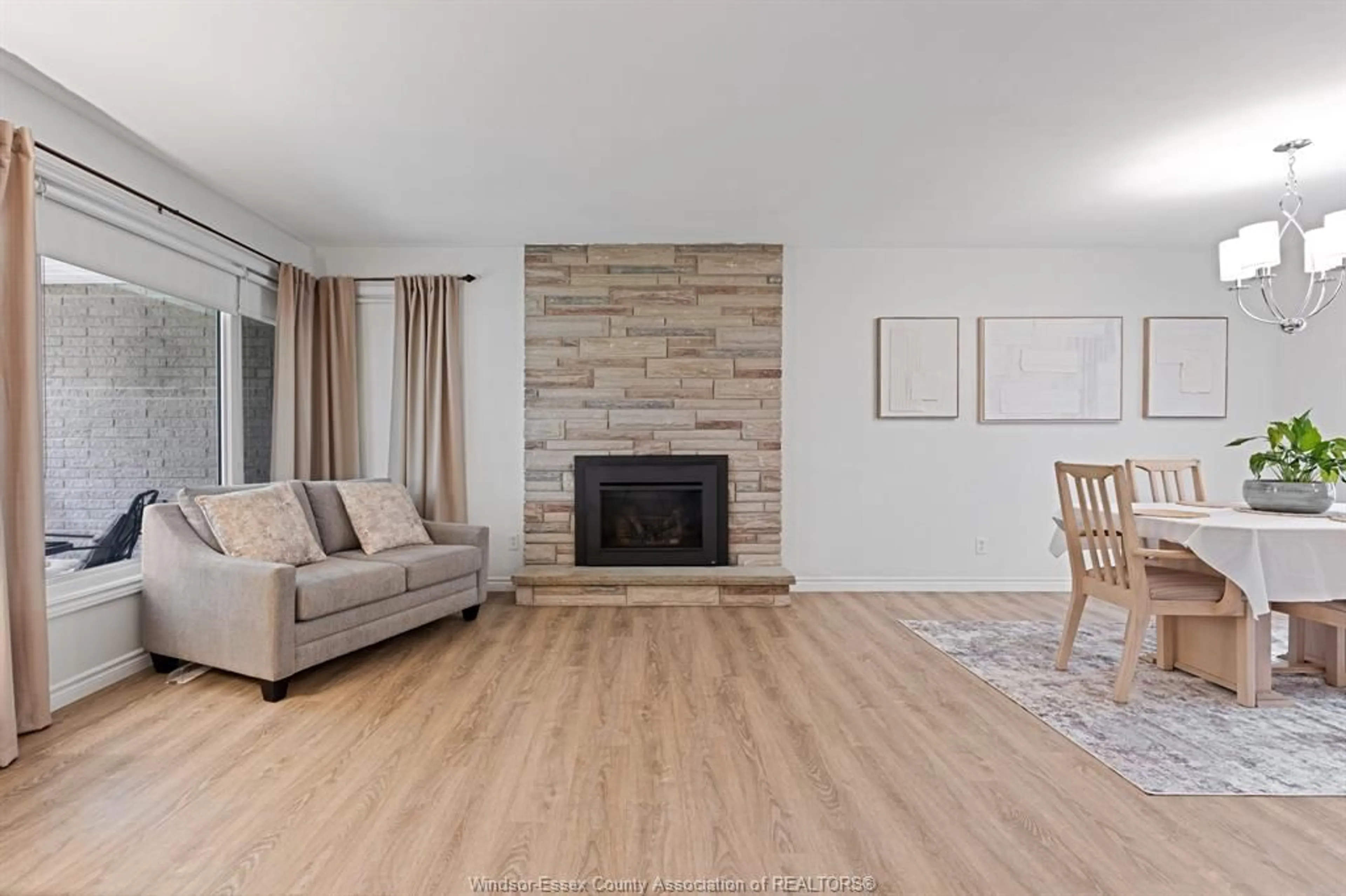 Living room with furniture, wood/laminate floor for 6480 BALL St, Stoney Point Ontario N0R 1N0