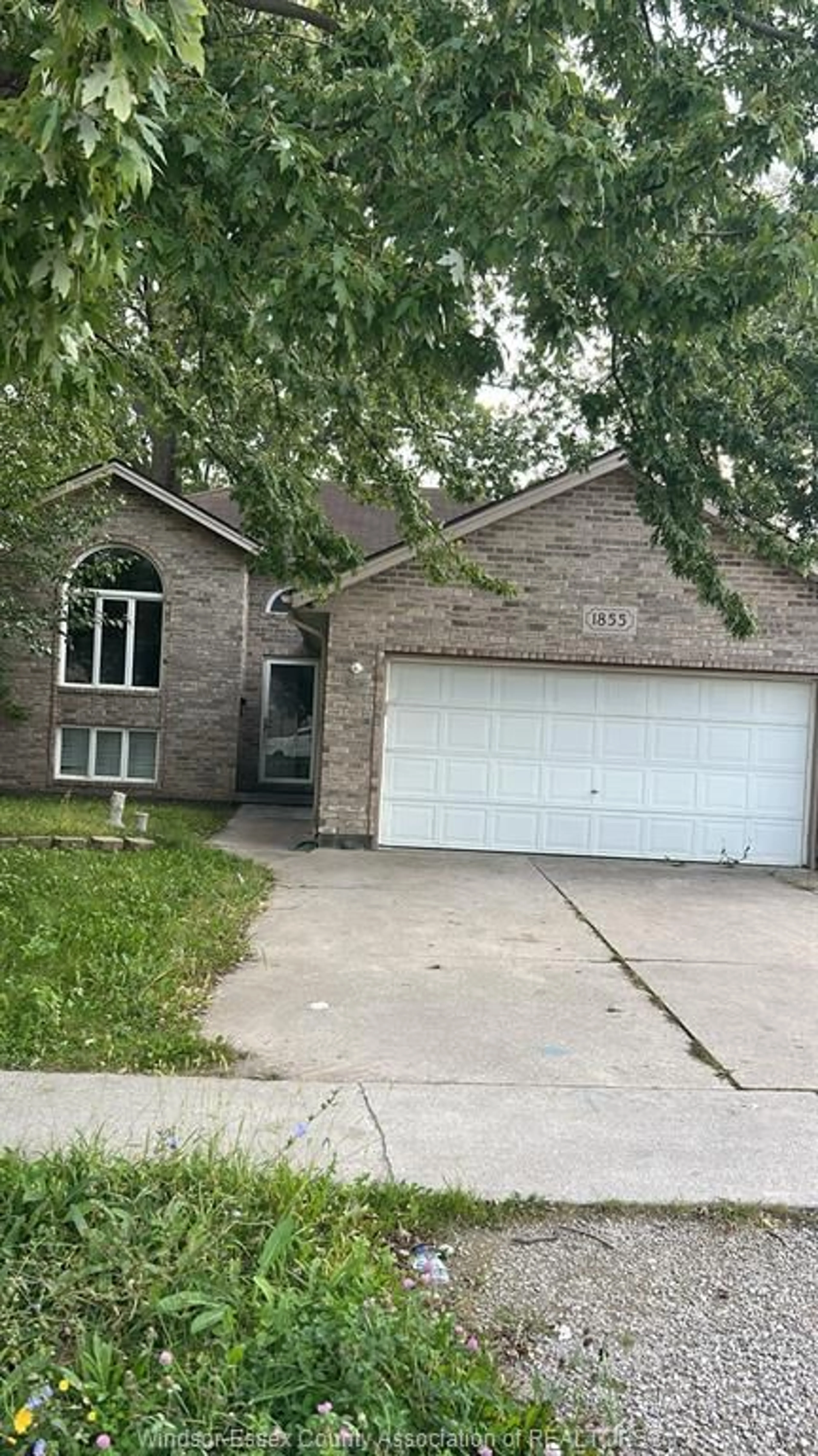 Home with brick exterior material, street for 1855 DOMINION Blvd, Windsor Ontario N9B 3H8