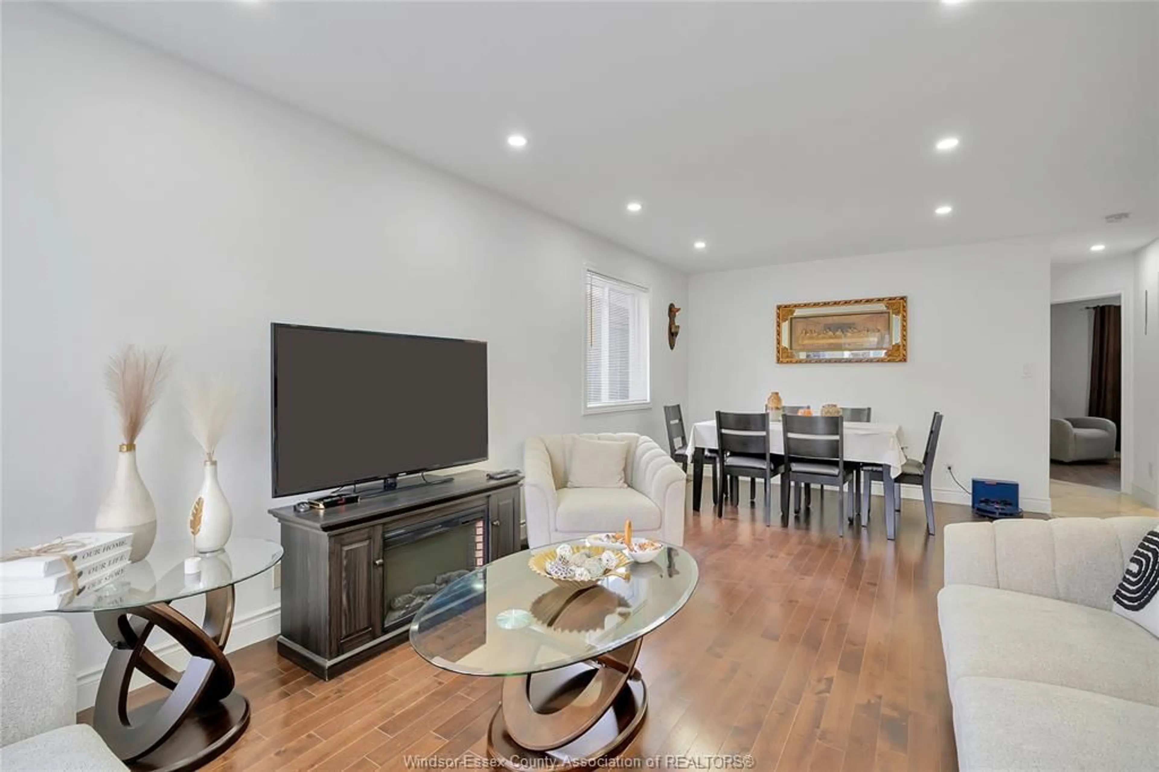 Living room with furniture, wood/laminate floor for 2651 TEEDIE Cres, Windsor Ontario N8R 2K5