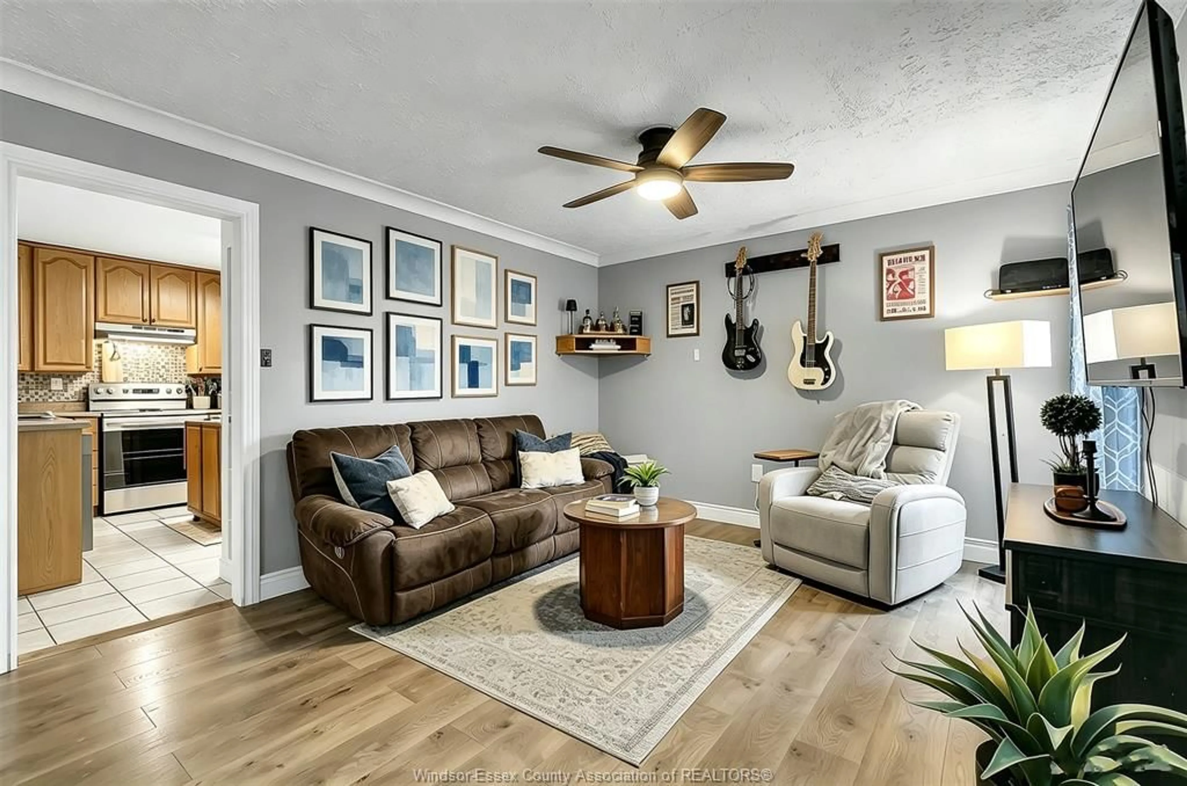 Living room with furniture, wood/laminate floor for 1730 AUBIN Rd, Windsor Ontario N8Y 4G5