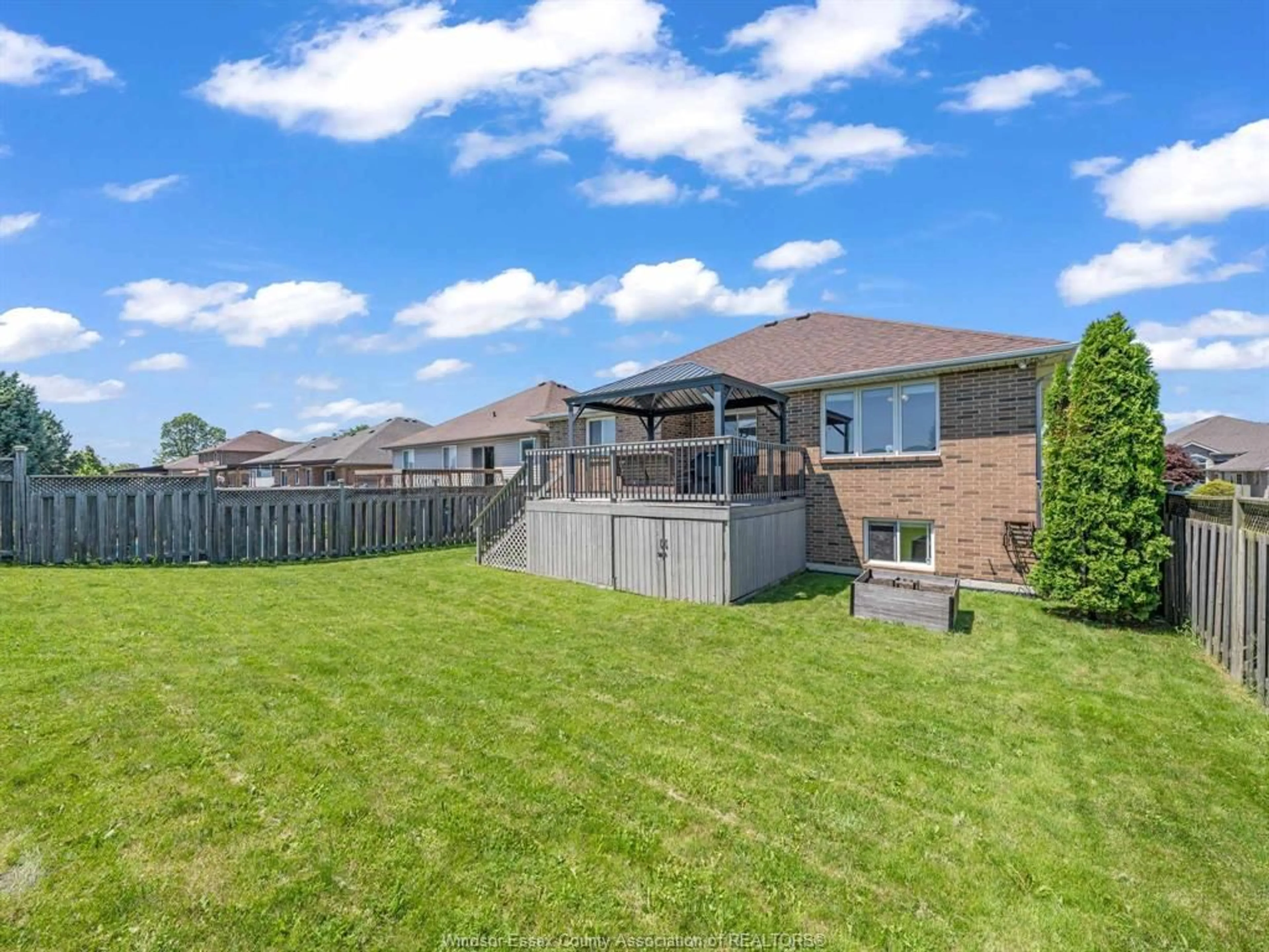 A pic from outside/outdoor area/front of a property/back of a property/a pic from drone, water/lake/river/ocean view for 1541 Heatherglen Dr, Tecumseh Ontario N8N 5B3