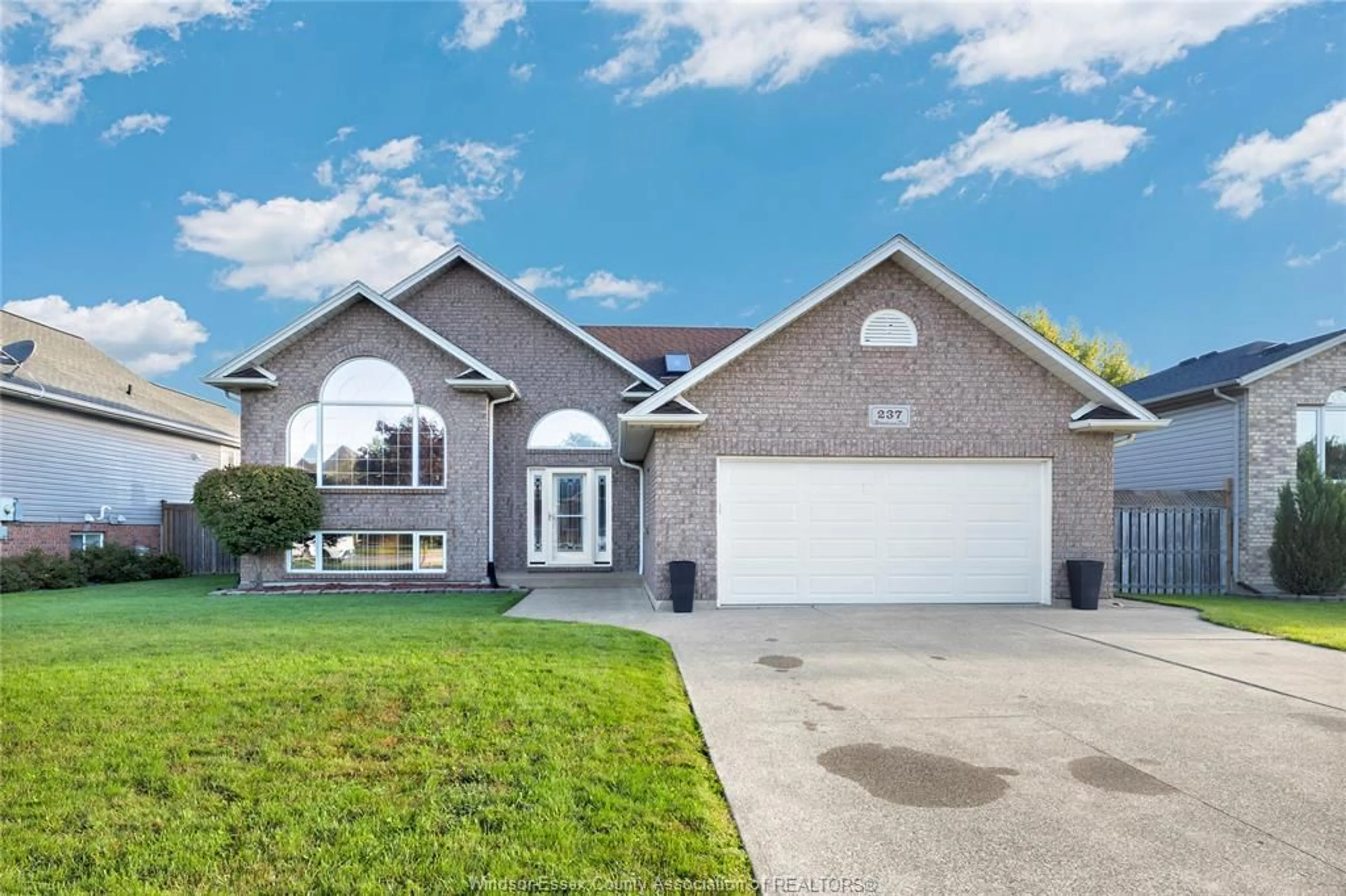 Home with vinyl exterior material, street for 237 WOODVIEW Dr, Essex Ontario N8M 3E9