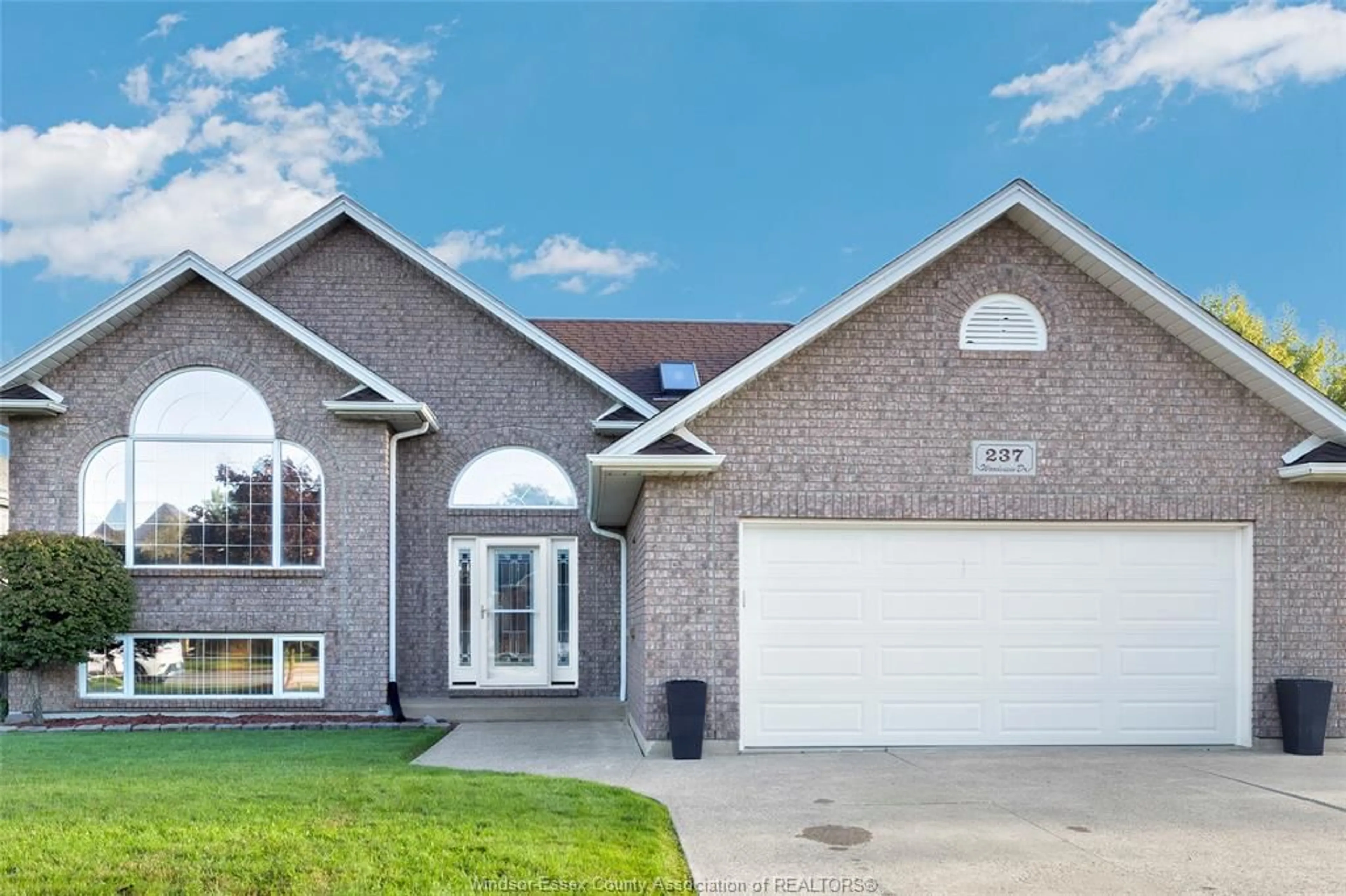 Home with brick exterior material, street for 237 WOODVIEW Dr, Essex Ontario N8M 3E9