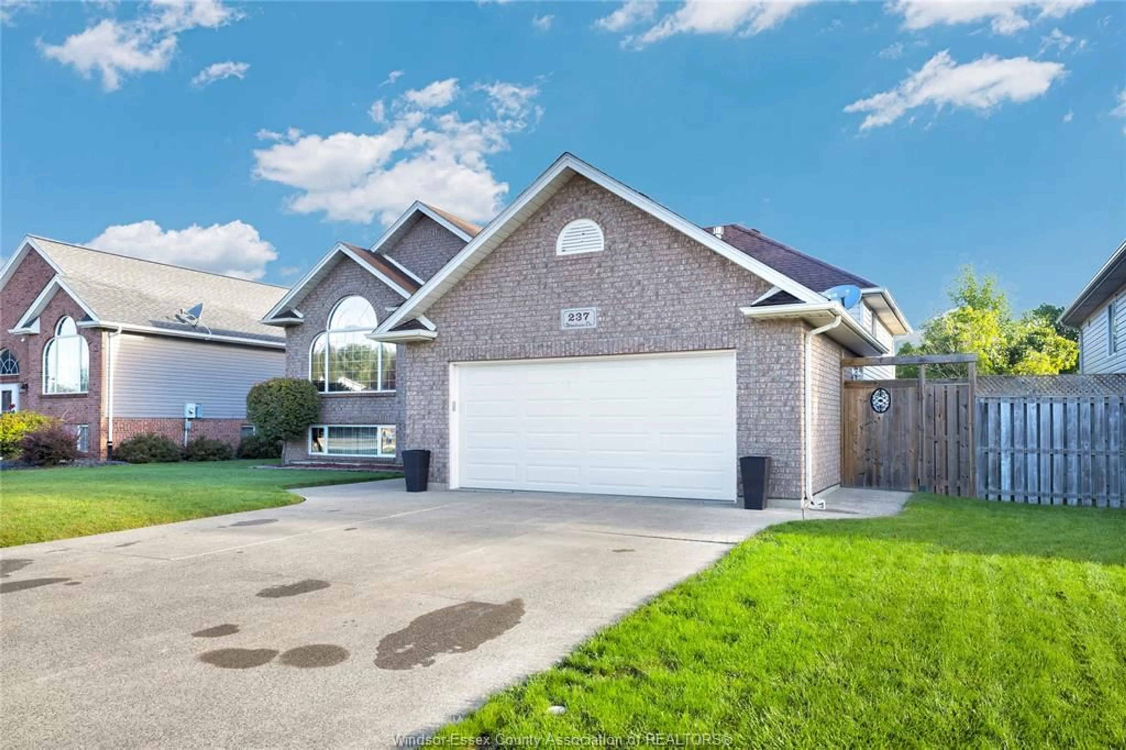 Home with vinyl exterior material, street for 237 WOODVIEW Dr, Essex Ontario N8M 3E9