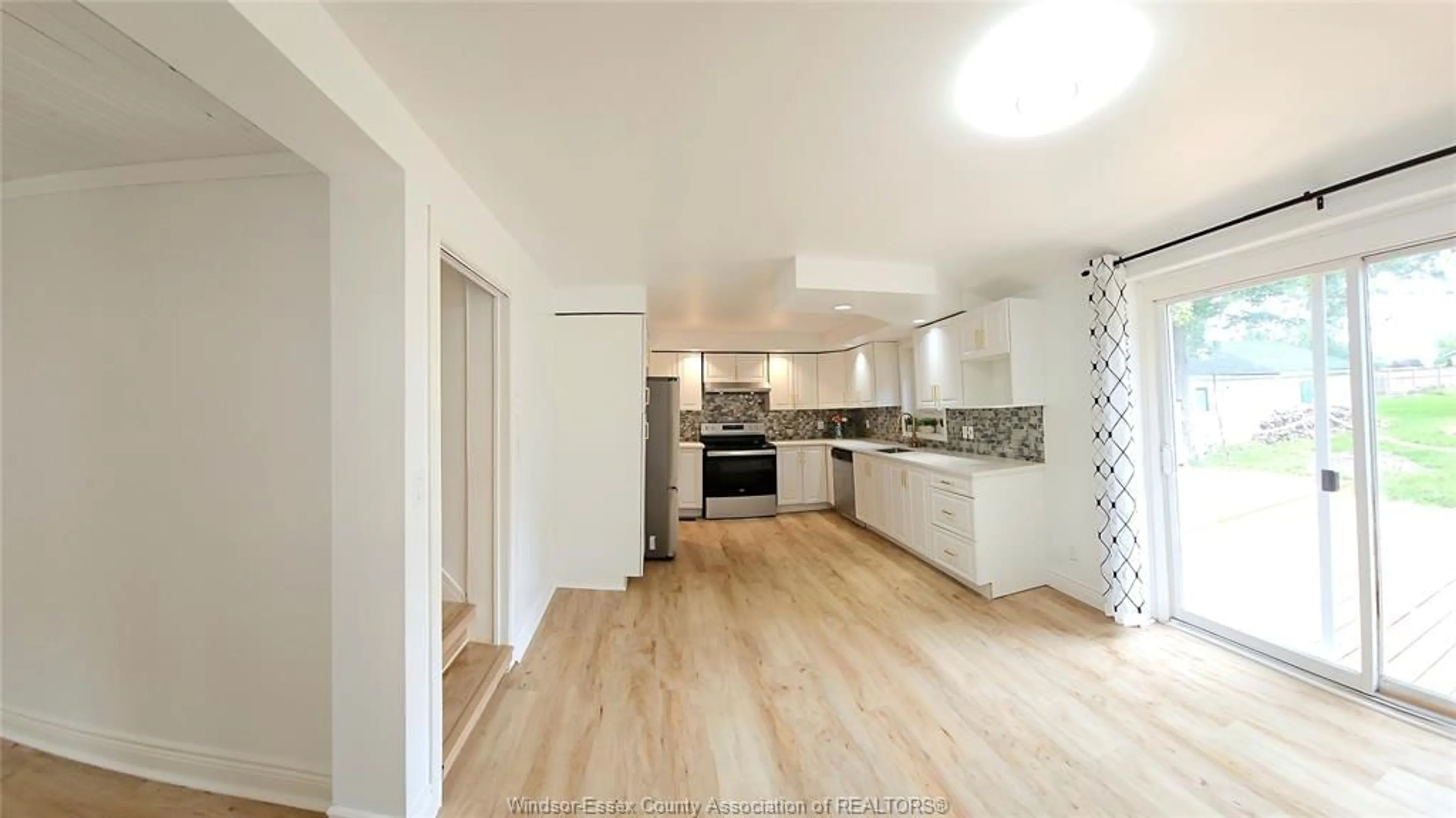 Open concept kitchen, wood/laminate floor for 23 ELLA St, Tilbury Ontario N0P 2L0