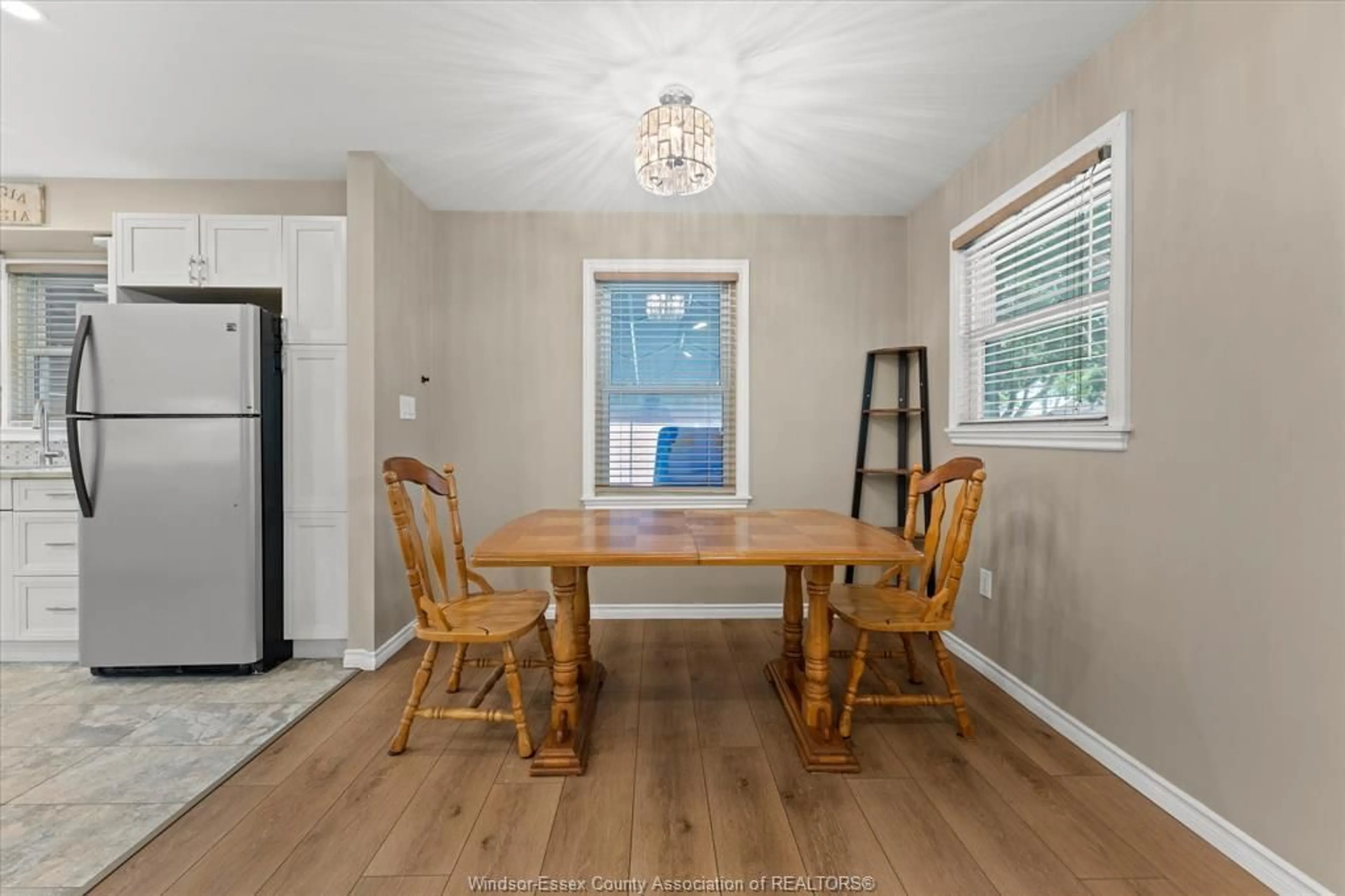 Dining room, wood/laminate floor for 3163 Curry Ave, Windsor Ontario N9E 2T2