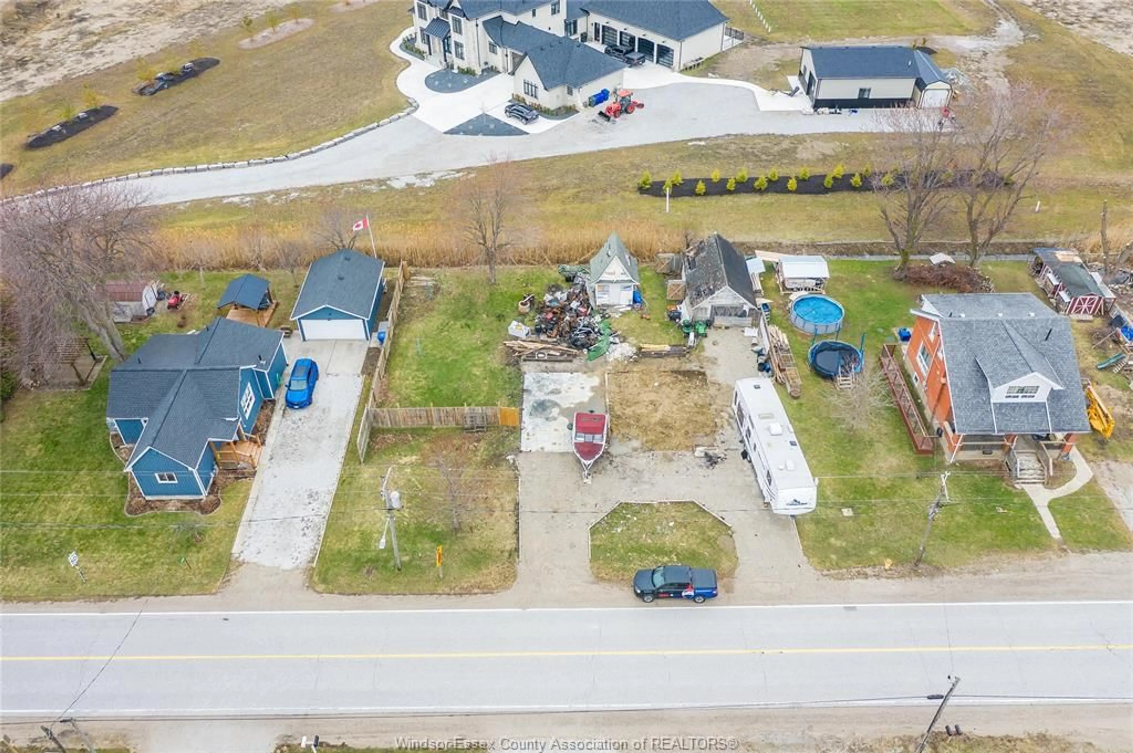 A pic from outside/outdoor area/front of a property/back of a property/a pic from drone, street for 2265 COUNTY RD 31, Lakeshore Ontario N0R 1R0