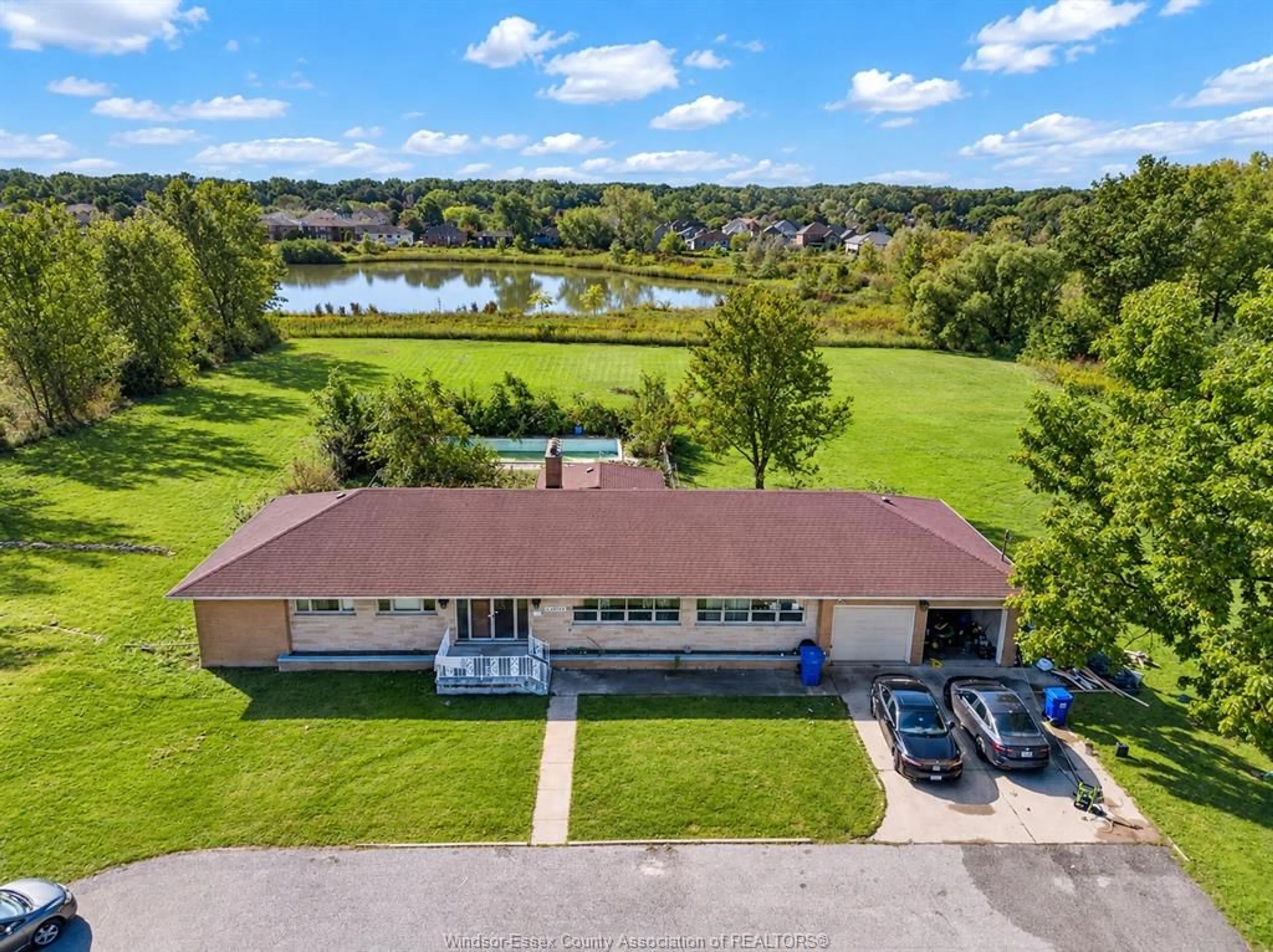 A pic from outside/outdoor area/front of a property/back of a property/a pic from drone, water/lake/river/ocean view for 2775 TODD Lane, LaSalle Ontario N9H 1K9