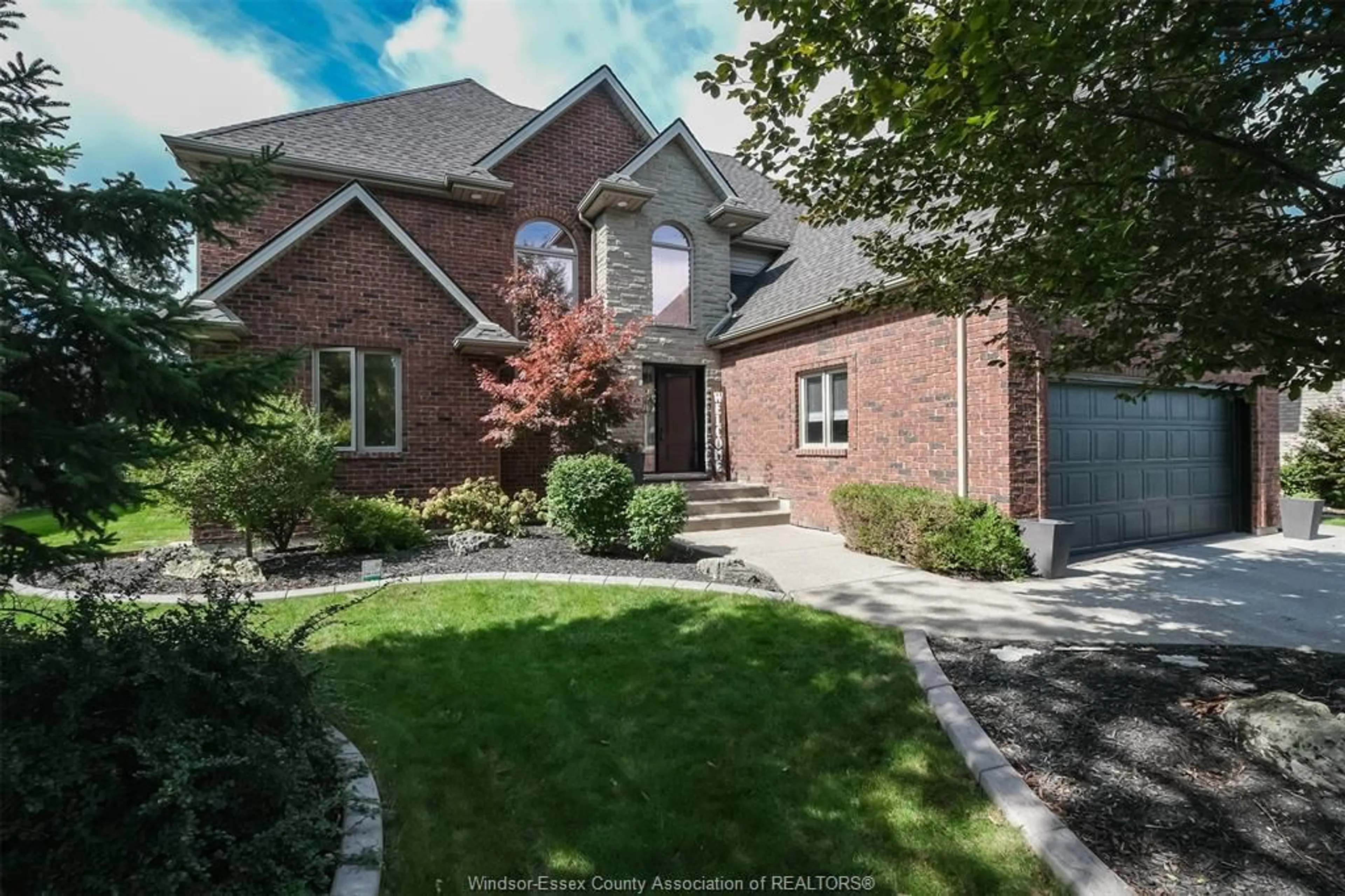 Home with brick exterior material, street for 369 PINEHURST Dr, Lakeshore Ontario N8L 0V8