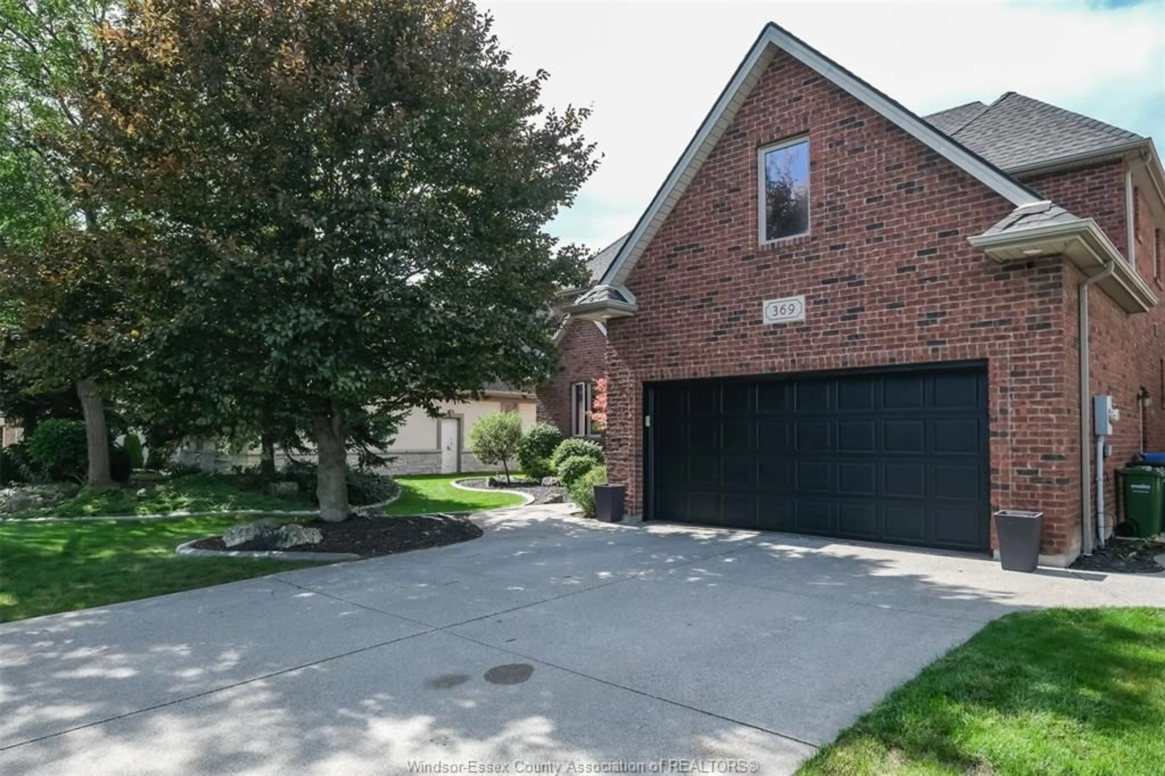 Home with brick exterior material, street for 369 PINEHURST Dr, Lakeshore Ontario N8L 0V8
