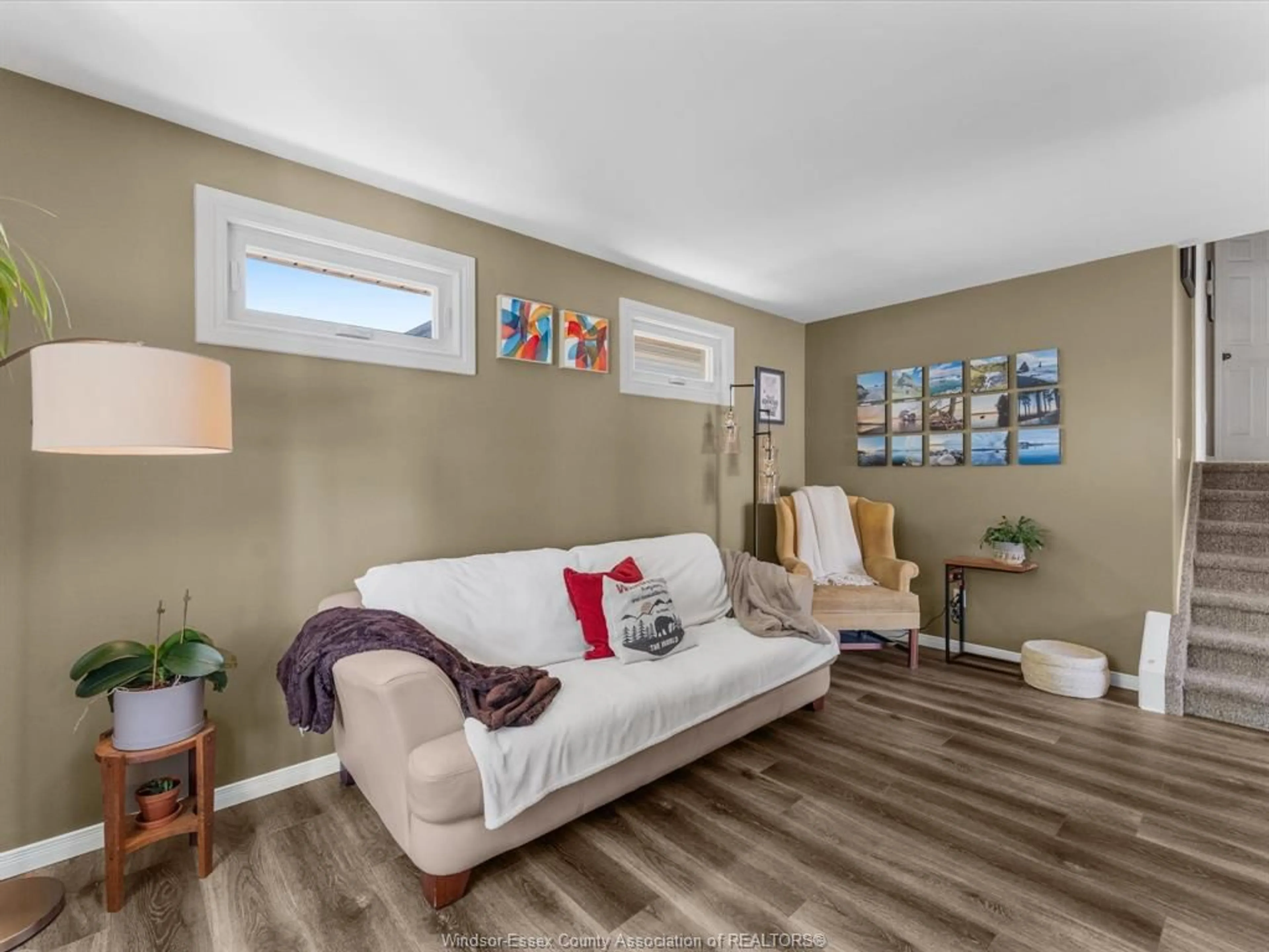Living room with furniture, wood/laminate floor for 3461 CARIBOU, Windsor Ontario N8W 5V4