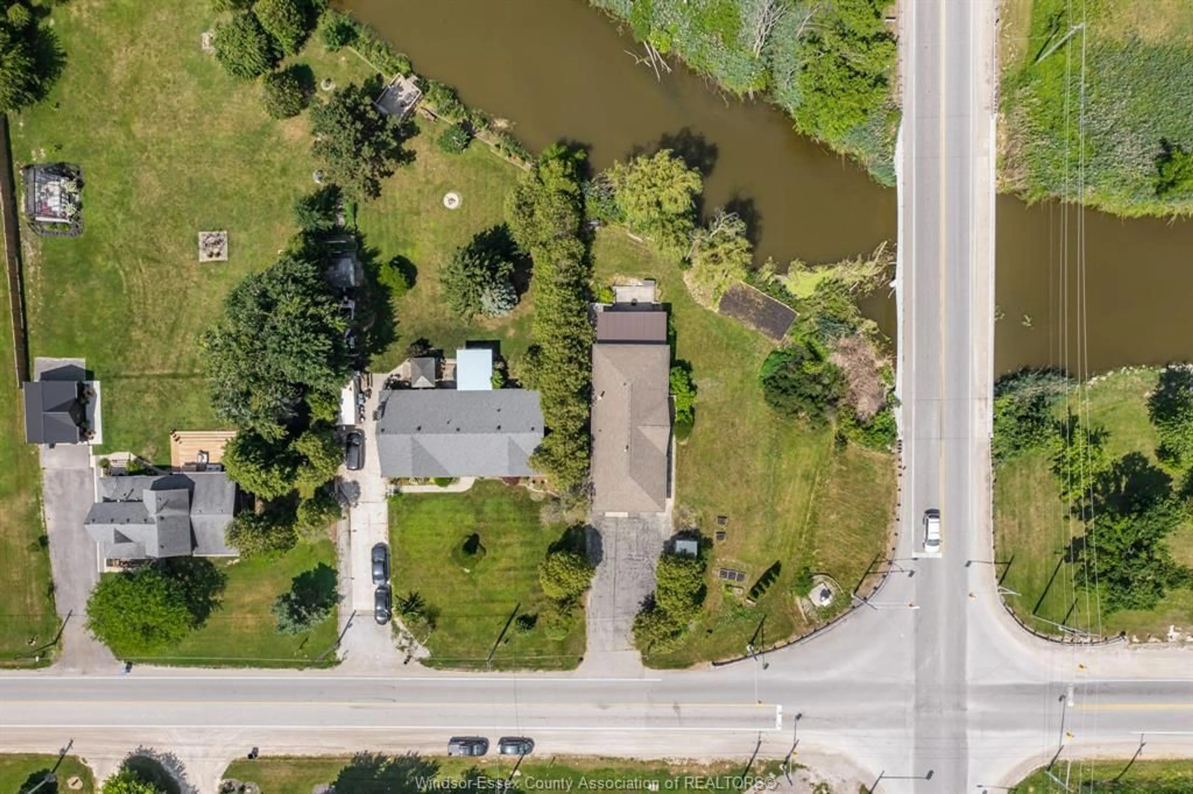 A pic from outside/outdoor area/front of a property/back of a property/a pic from drone, water/lake/river/ocean view for 1203 BELLE RIVER Rd, Lakeshore Ontario N8L 1B7