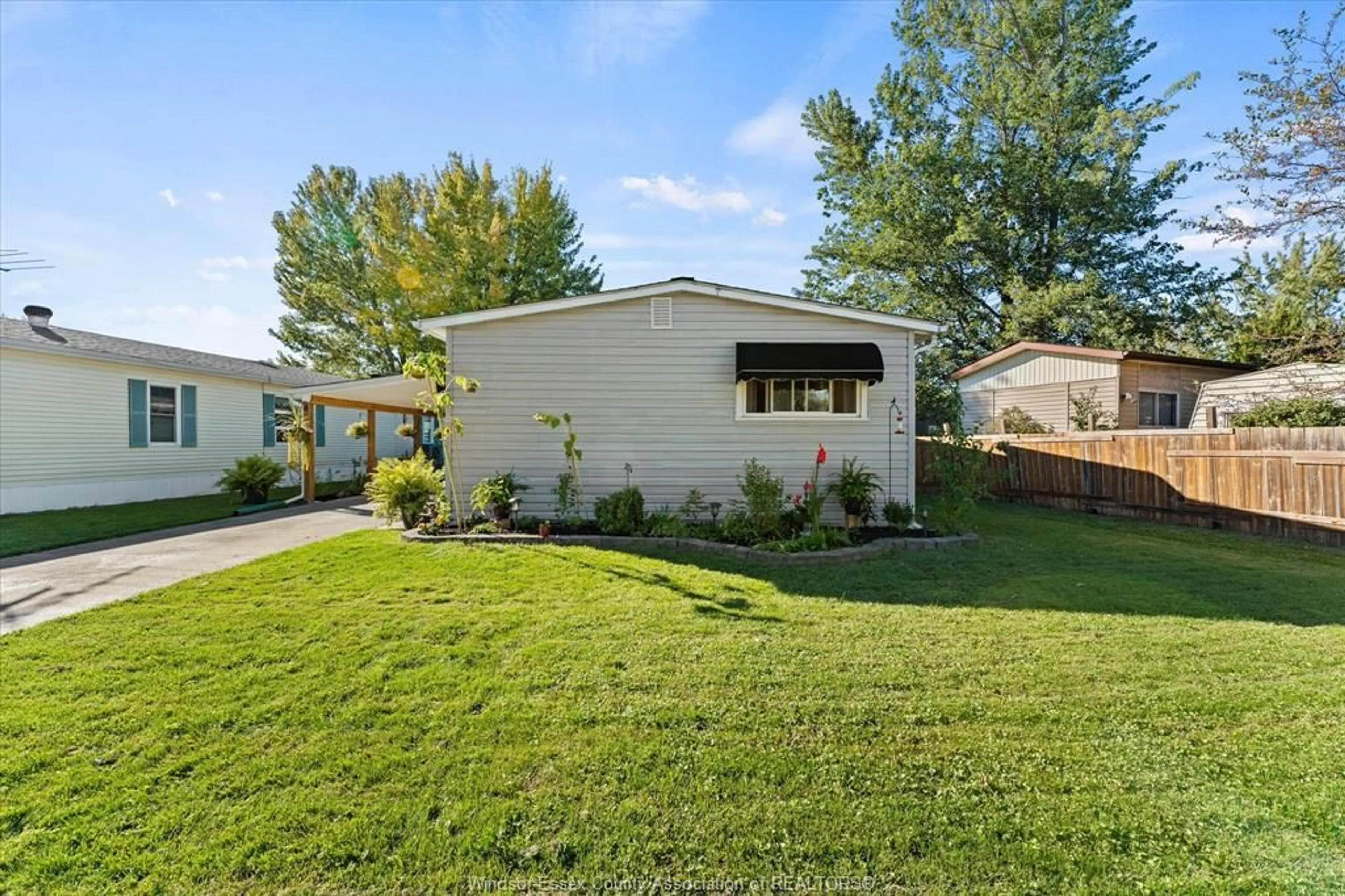 Home with vinyl exterior material, street for 20 Poplar Dr #193, McGregor Ontario N0R 1J0