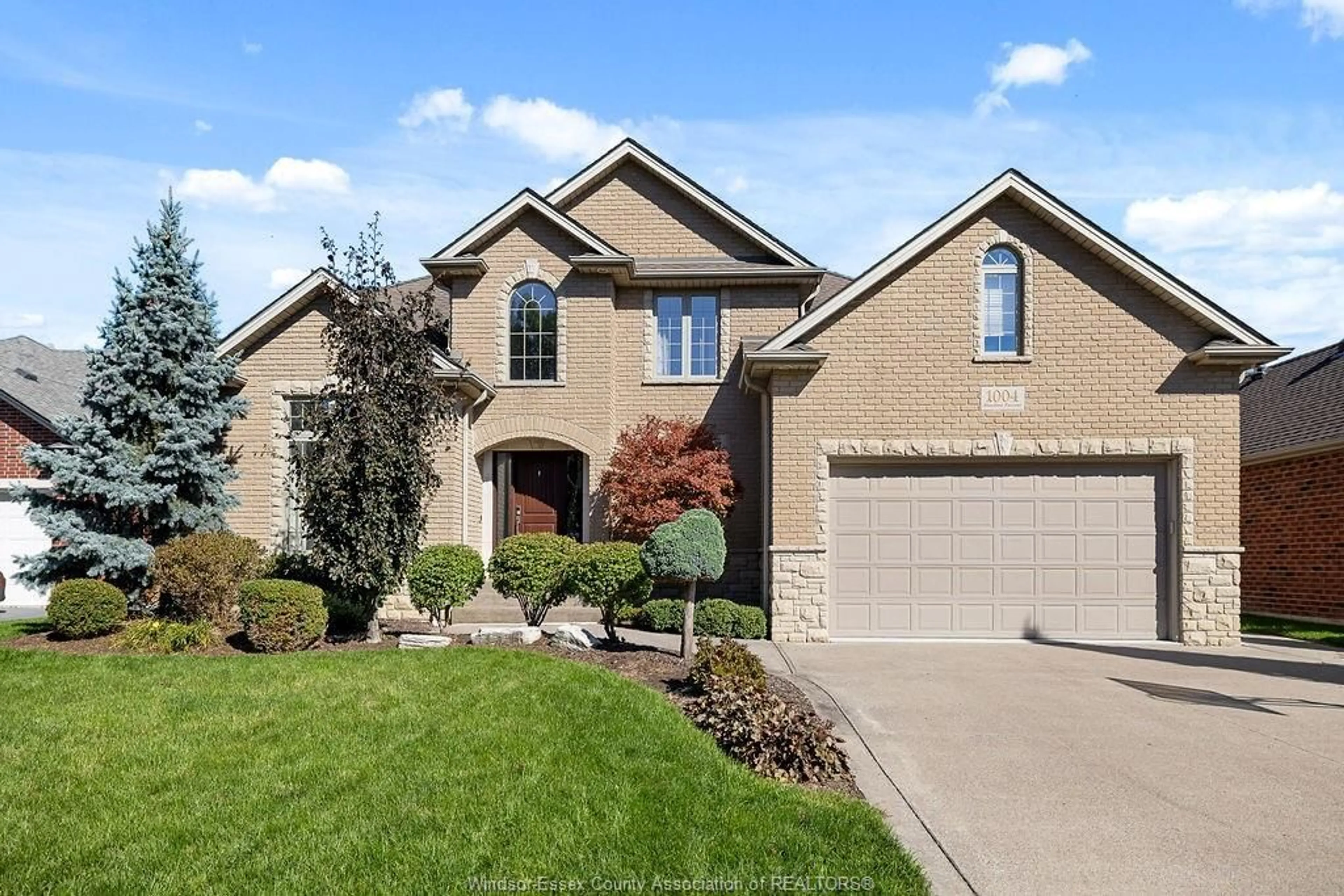 Home with brick exterior material, street for 1004 WOODLAND CRES, Lakeshore Ontario N8L 0V9