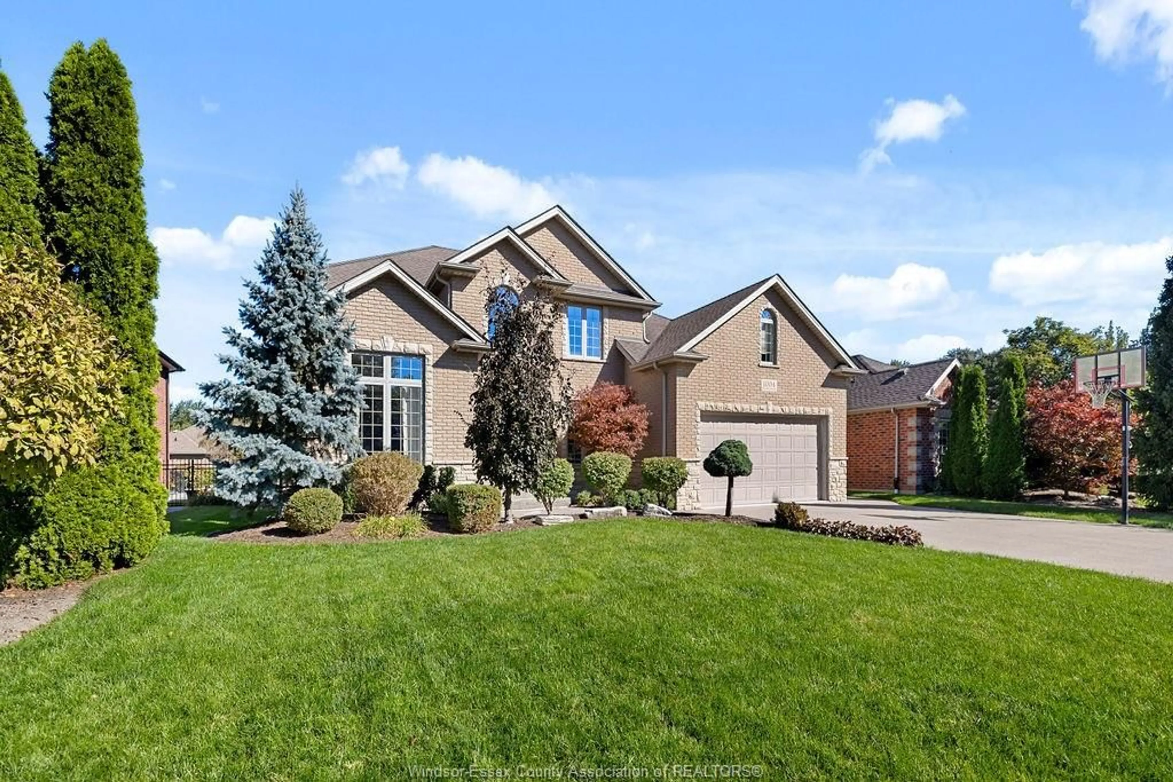 Home with brick exterior material, street for 1004 WOODLAND CRES, Lakeshore Ontario N8L 0V9