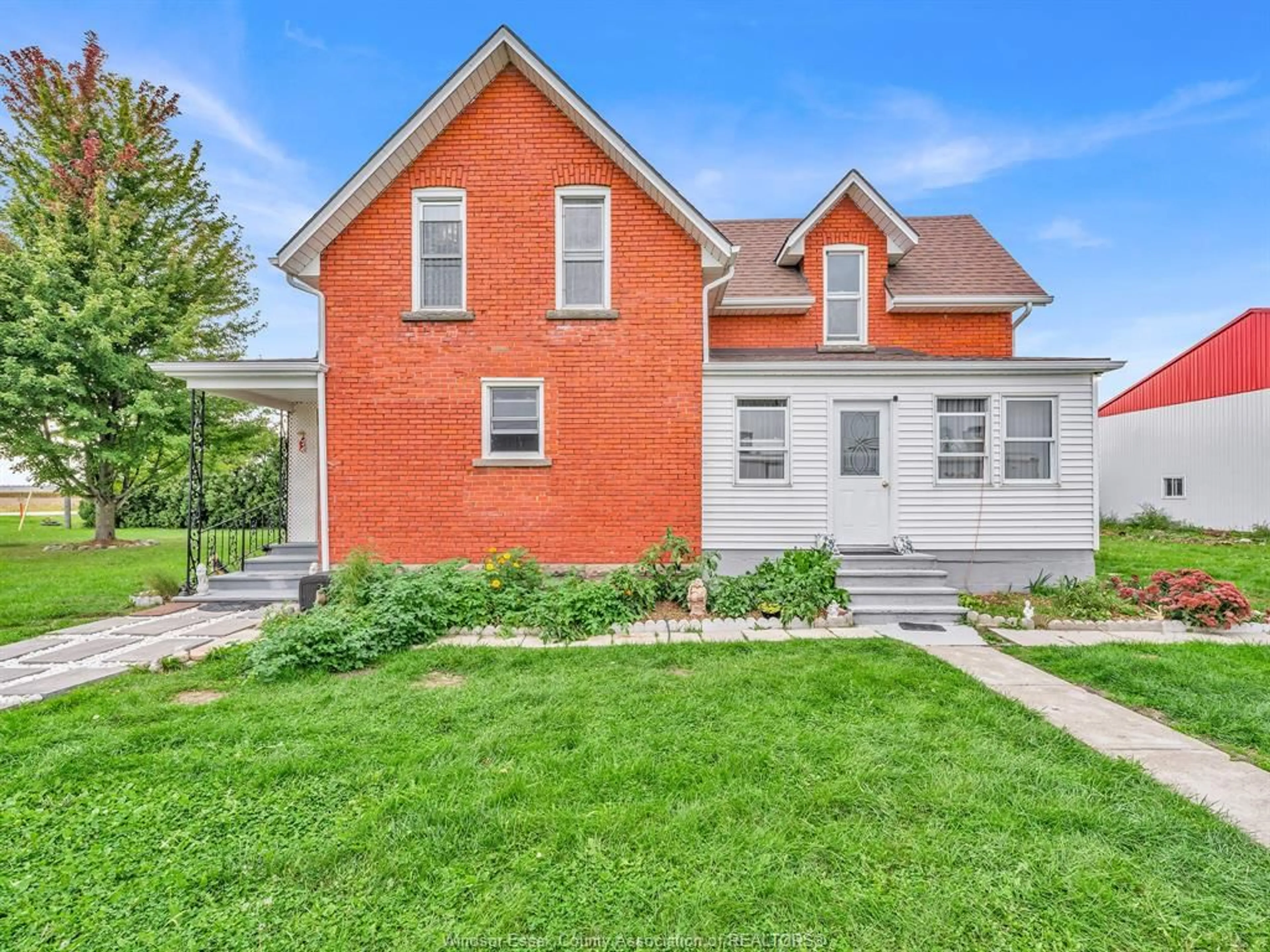 Home with brick exterior material, street for 909 Mersea Road 10, Leamington Ontario N0P 2J0