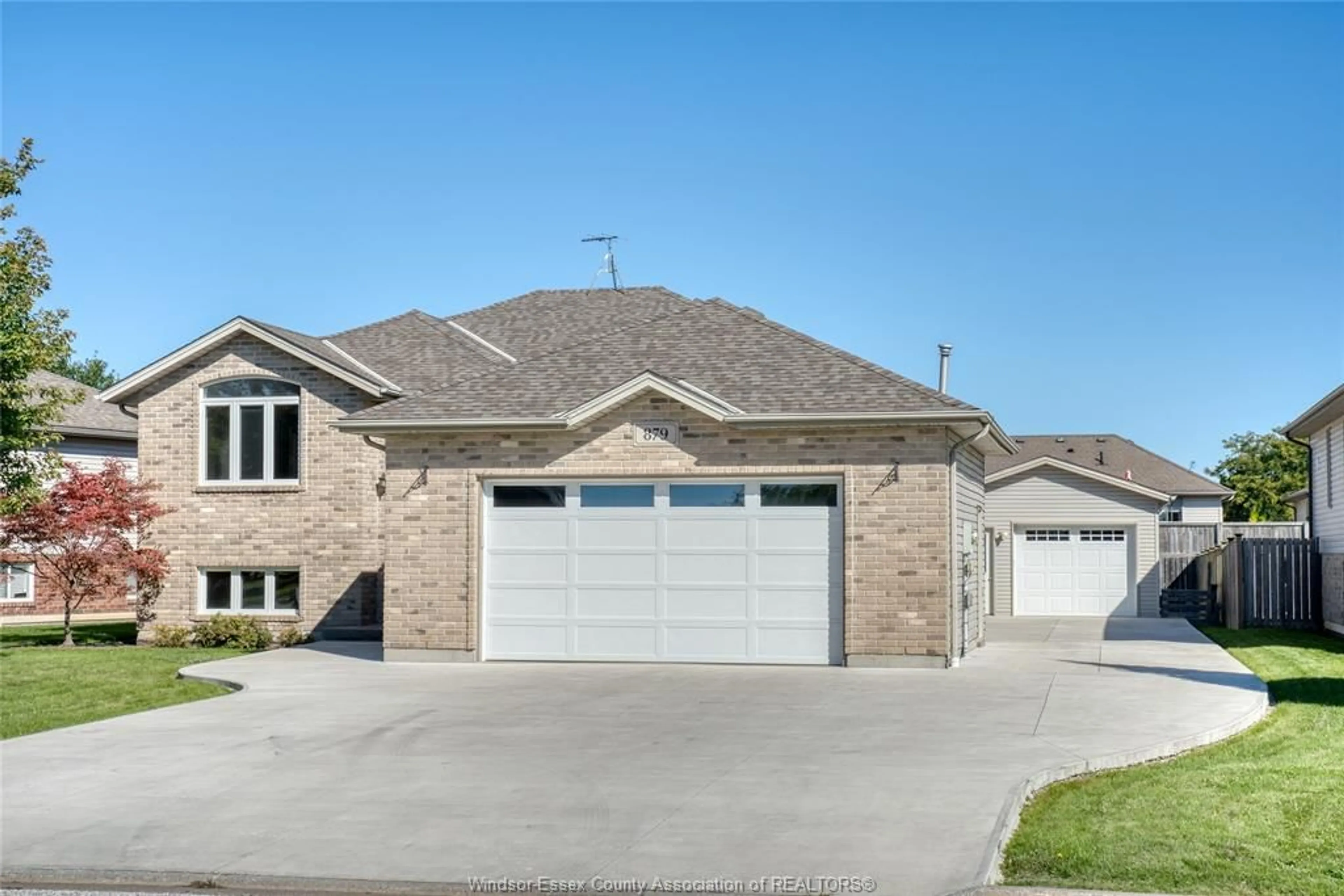 Home with brick exterior material, street for 879 WESTWOOD, Lakeshore Ontario N8L 1E9