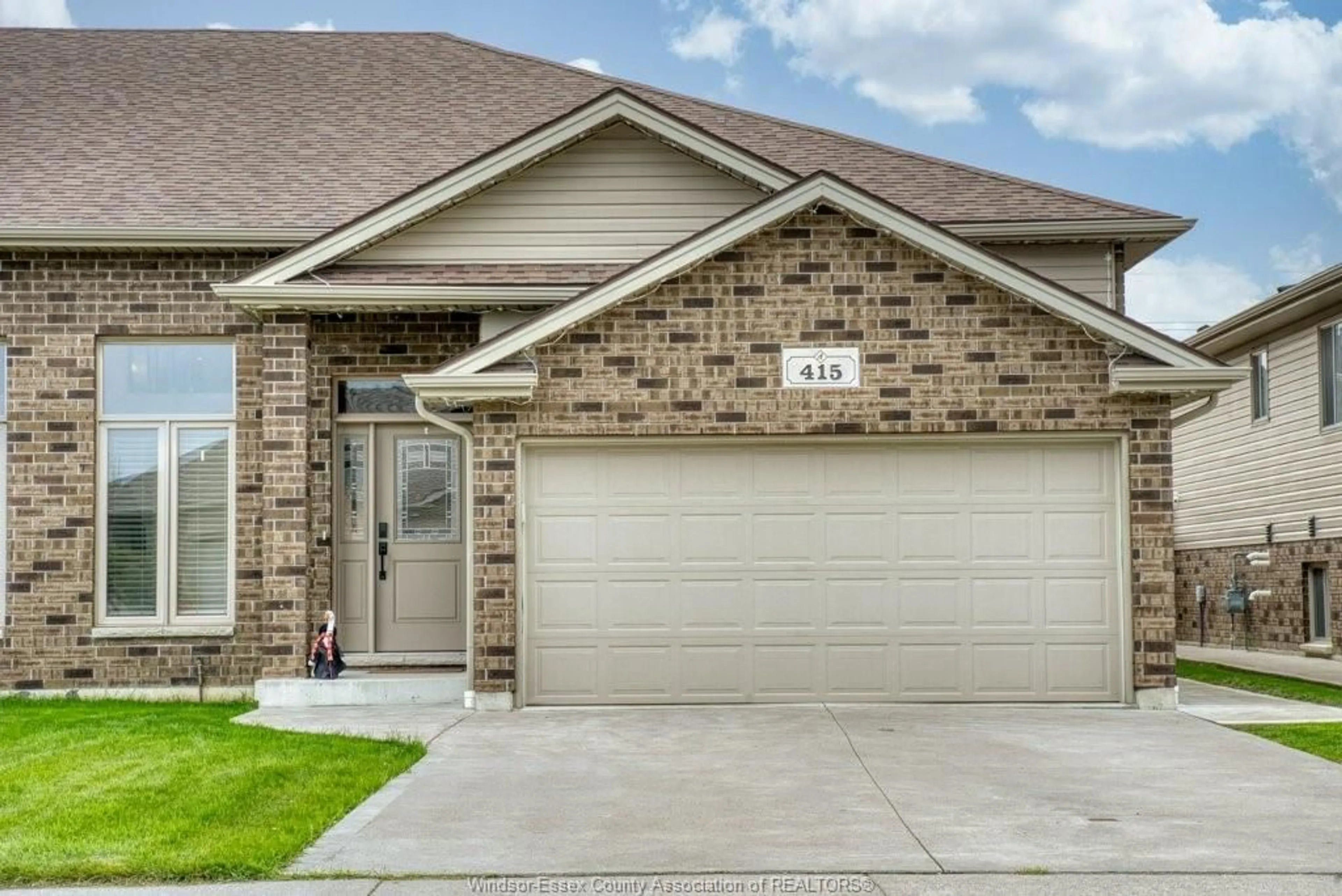 Home with brick exterior material, street for 415 ROSEWOOD Dr, Lakeshore Ontario N8L 1B9