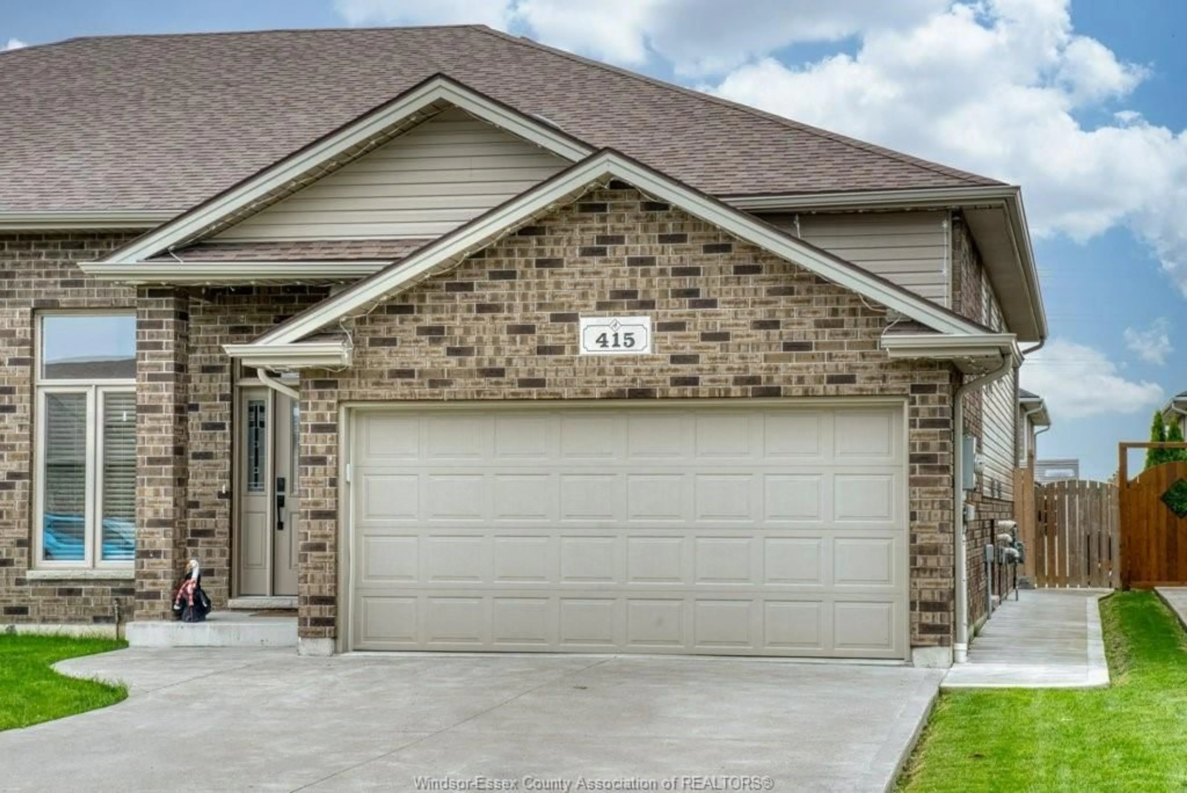 Home with brick exterior material, street for 415 ROSEWOOD Dr, Lakeshore Ontario N8L 1B9
