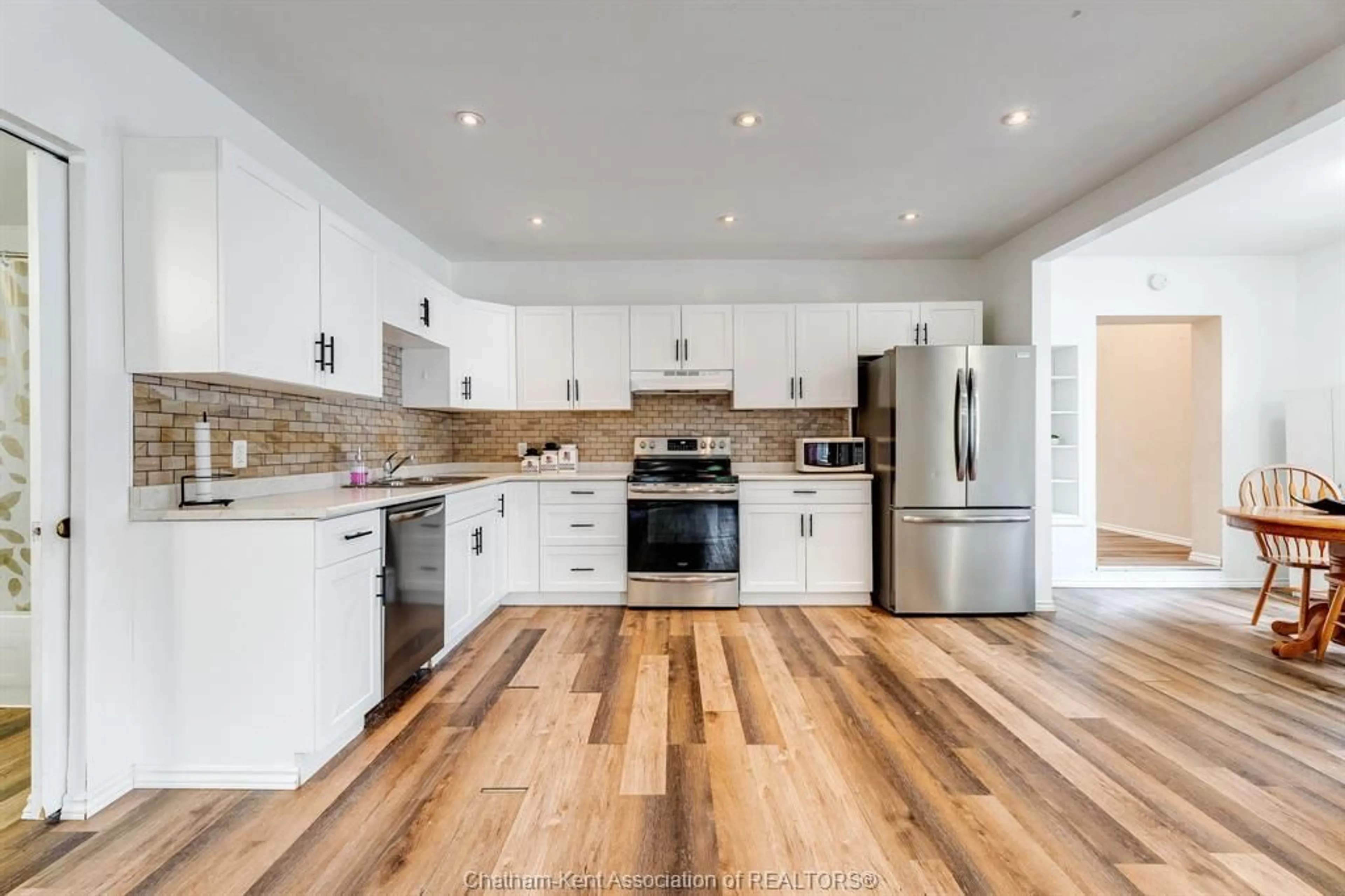 Open concept kitchen, wood/laminate floor for 171 Edgar St, Chatham Ontario N7M 1V6