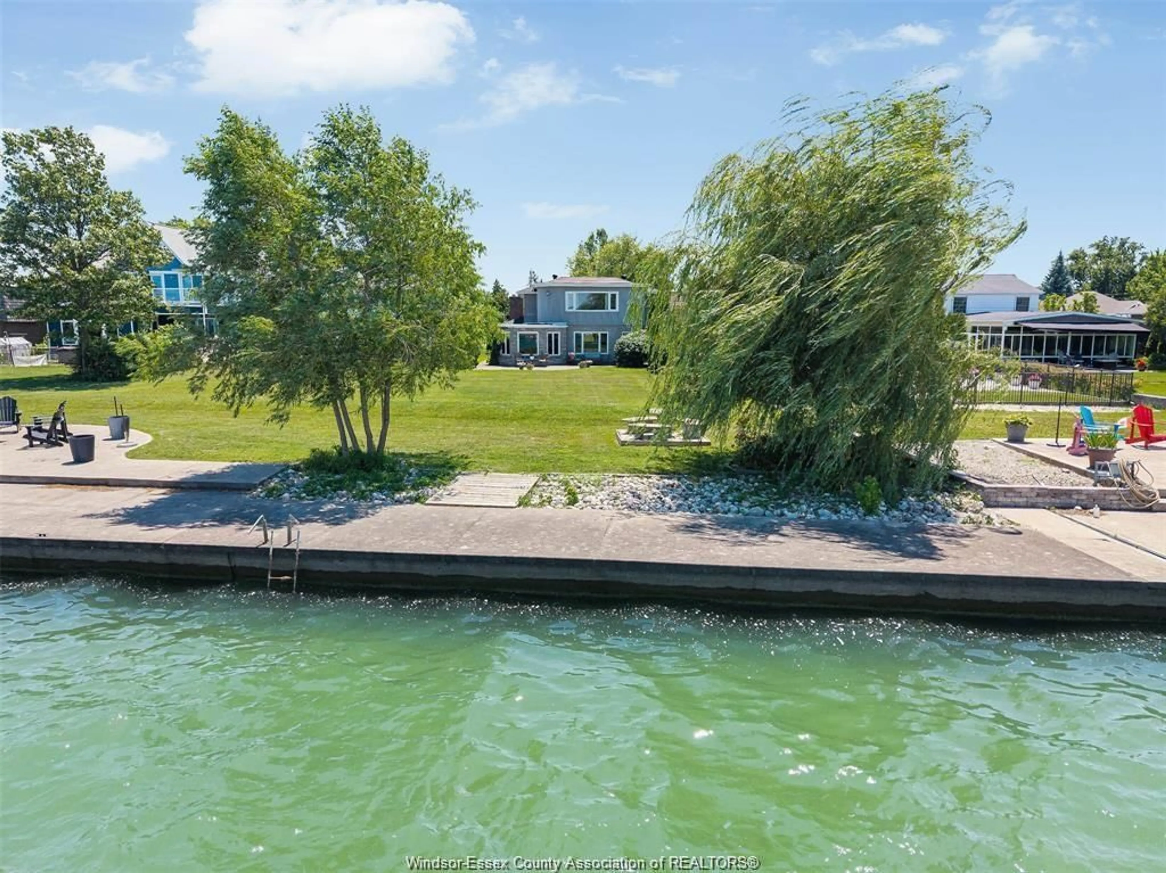 A pic from outside/outdoor area/front of a property/back of a property/a pic from drone, water/lake/river/ocean view for 11830 RIVERSIDE Dr, Windsor Ontario N8P 1A6