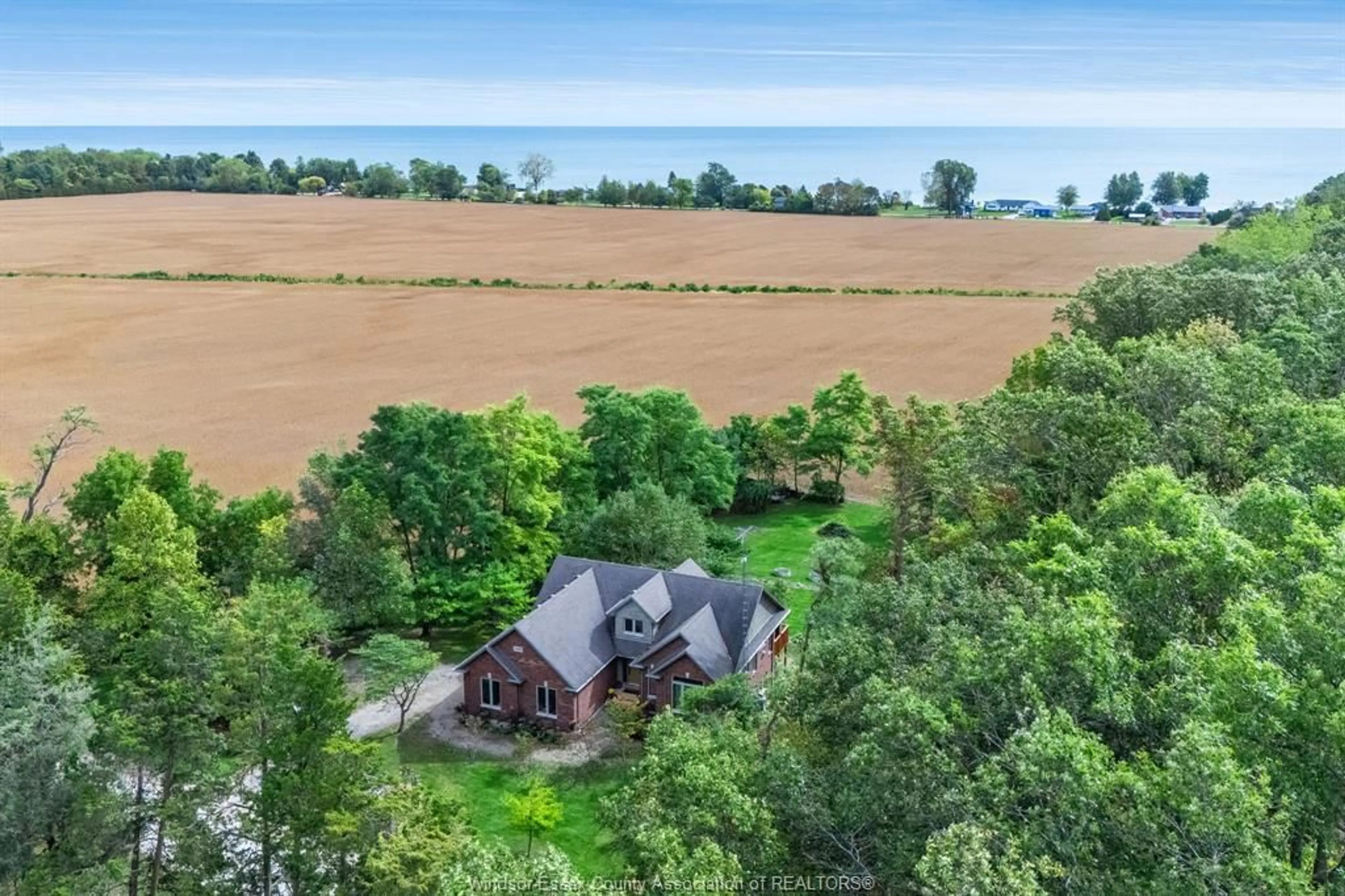 A pic from outside/outdoor area/front of a property/back of a property/a pic from drone, water/lake/river/ocean view for 21096 Cemetery Rd, Wheatley Ontario N0P 2P0