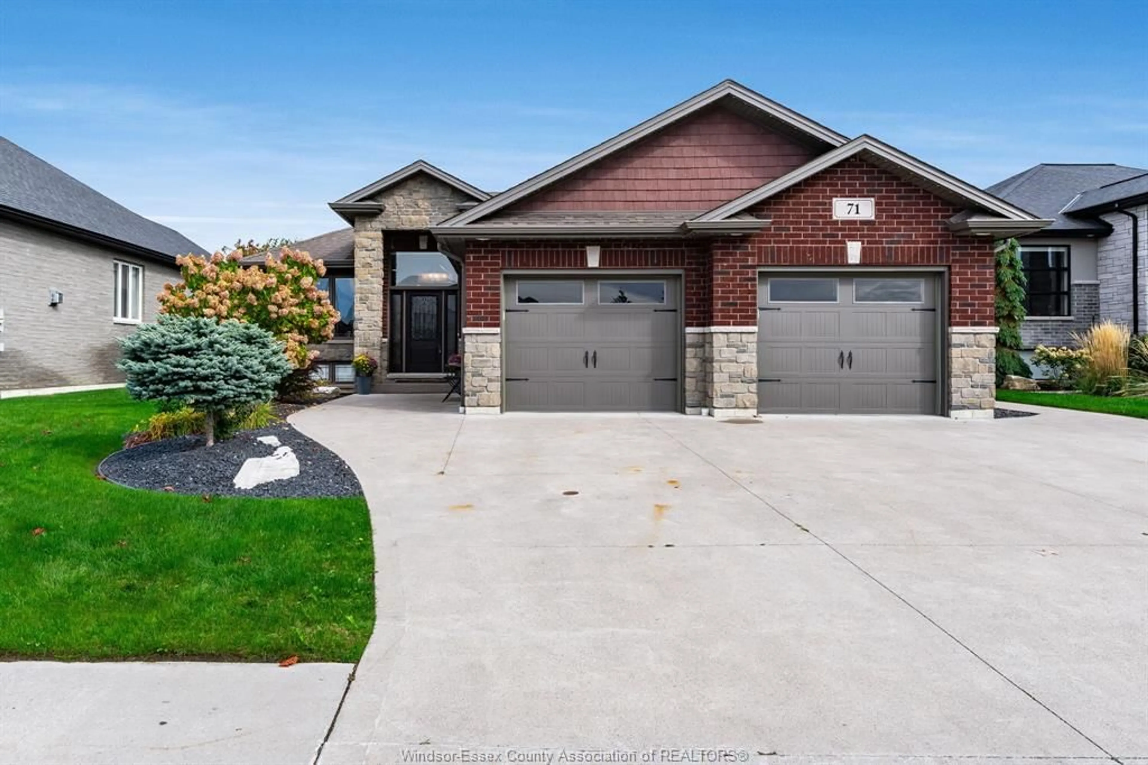 Home with brick exterior material, street for 71 Conservation Blvd, Kingsville Ontario N9Y 0E5
