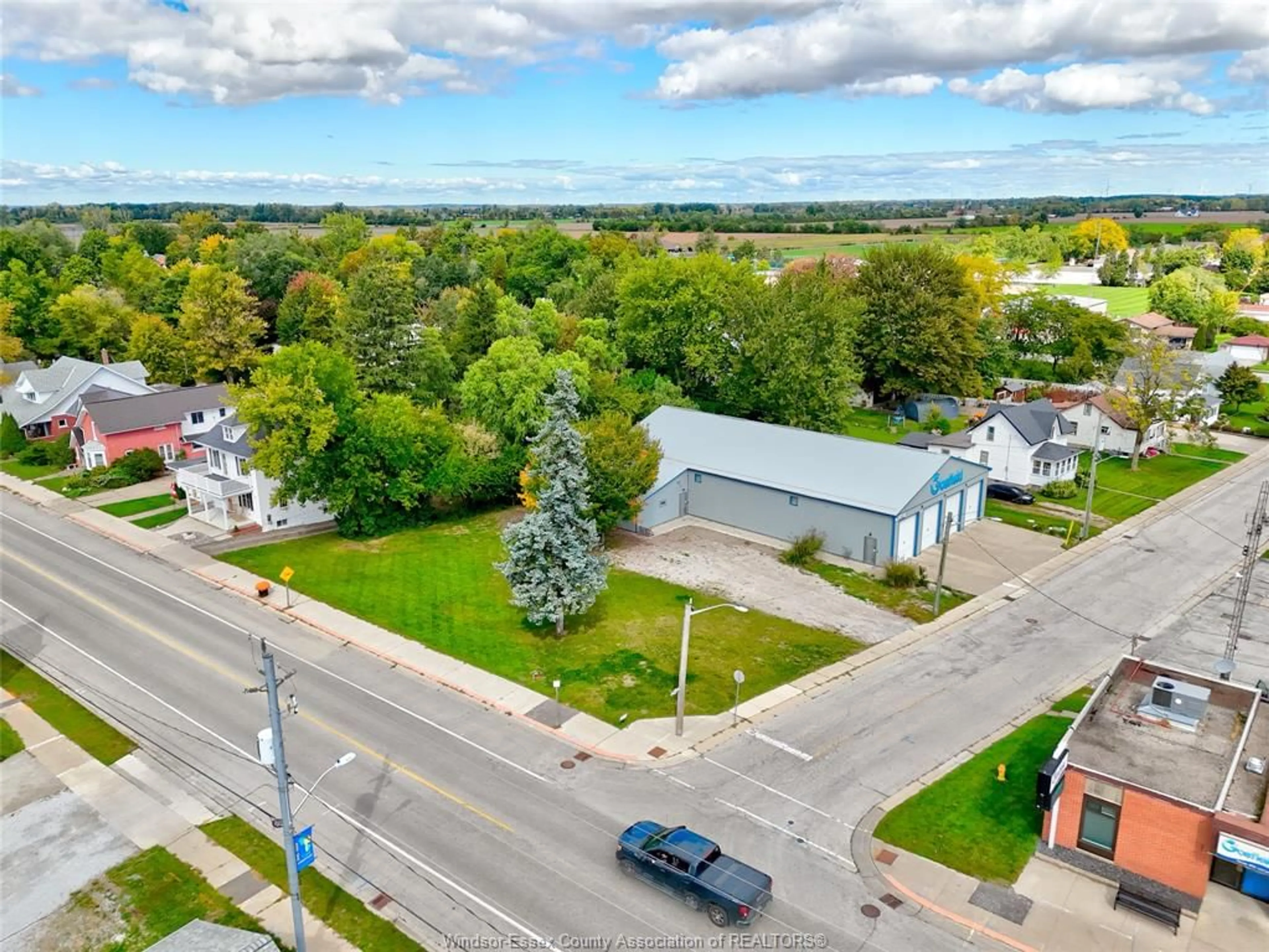 A pic from outside/outdoor area/front of a property/back of a property/a pic from drone, street for 134 COUNTY RD 34 E., Cottam Ontario N0R 1B0