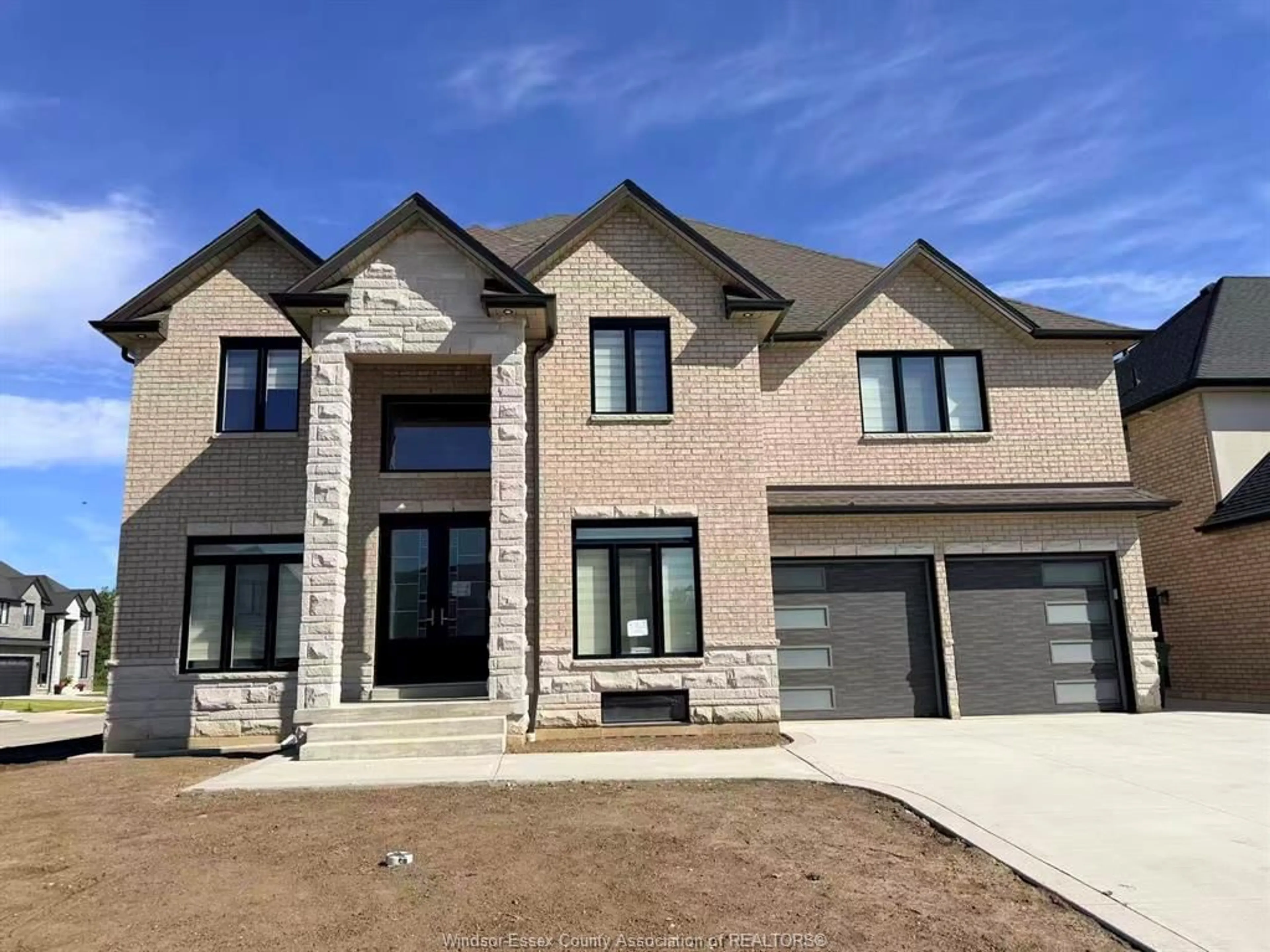 Home with brick exterior material, street for 570 ORCHARDS Cres, Windsor Ontario N9E 0B2