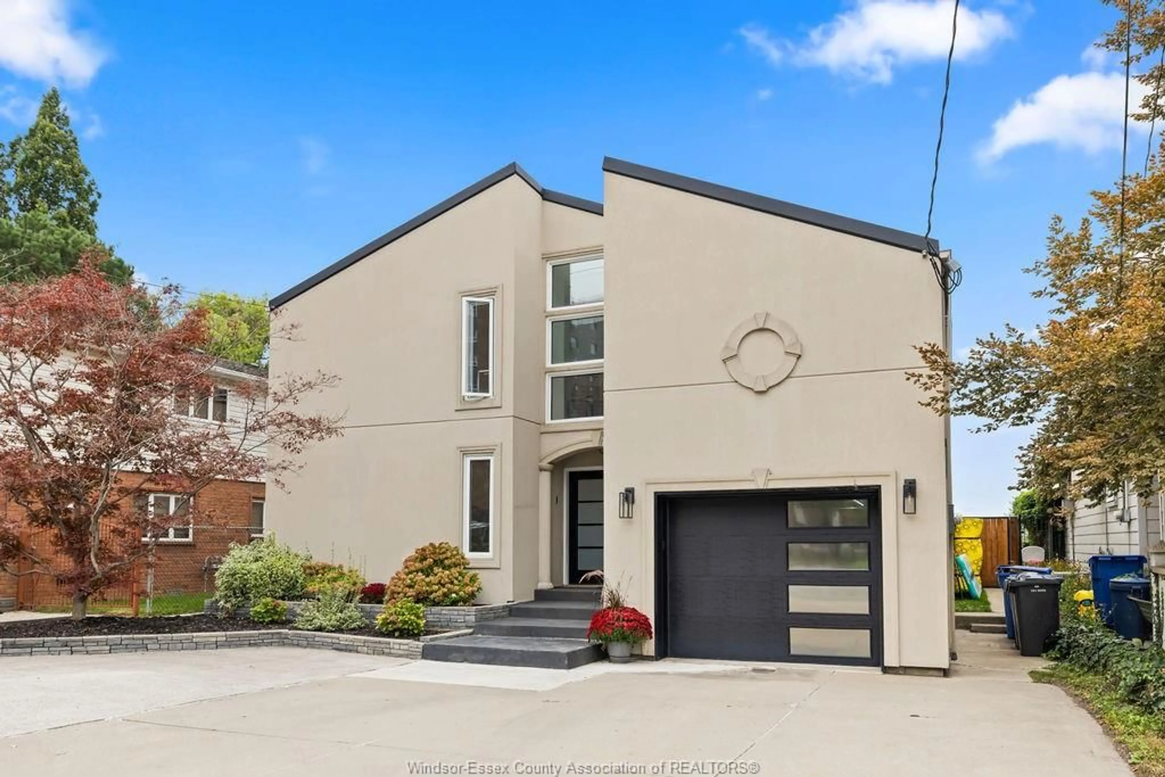 Home with brick exterior material, street for 8678 RIVERSIDE Dr, Windsor Ontario N8S 1E9
