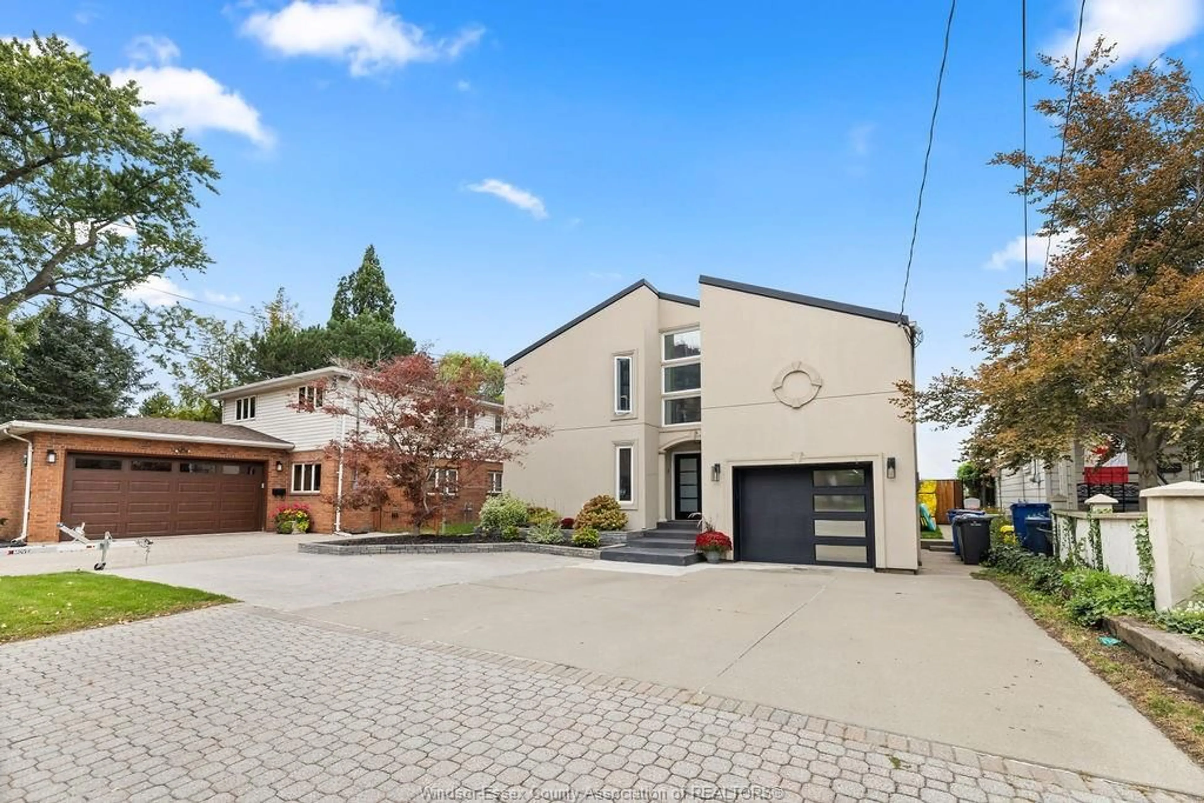 Home with brick exterior material, street for 8678 RIVERSIDE Dr, Windsor Ontario N8S 1E9