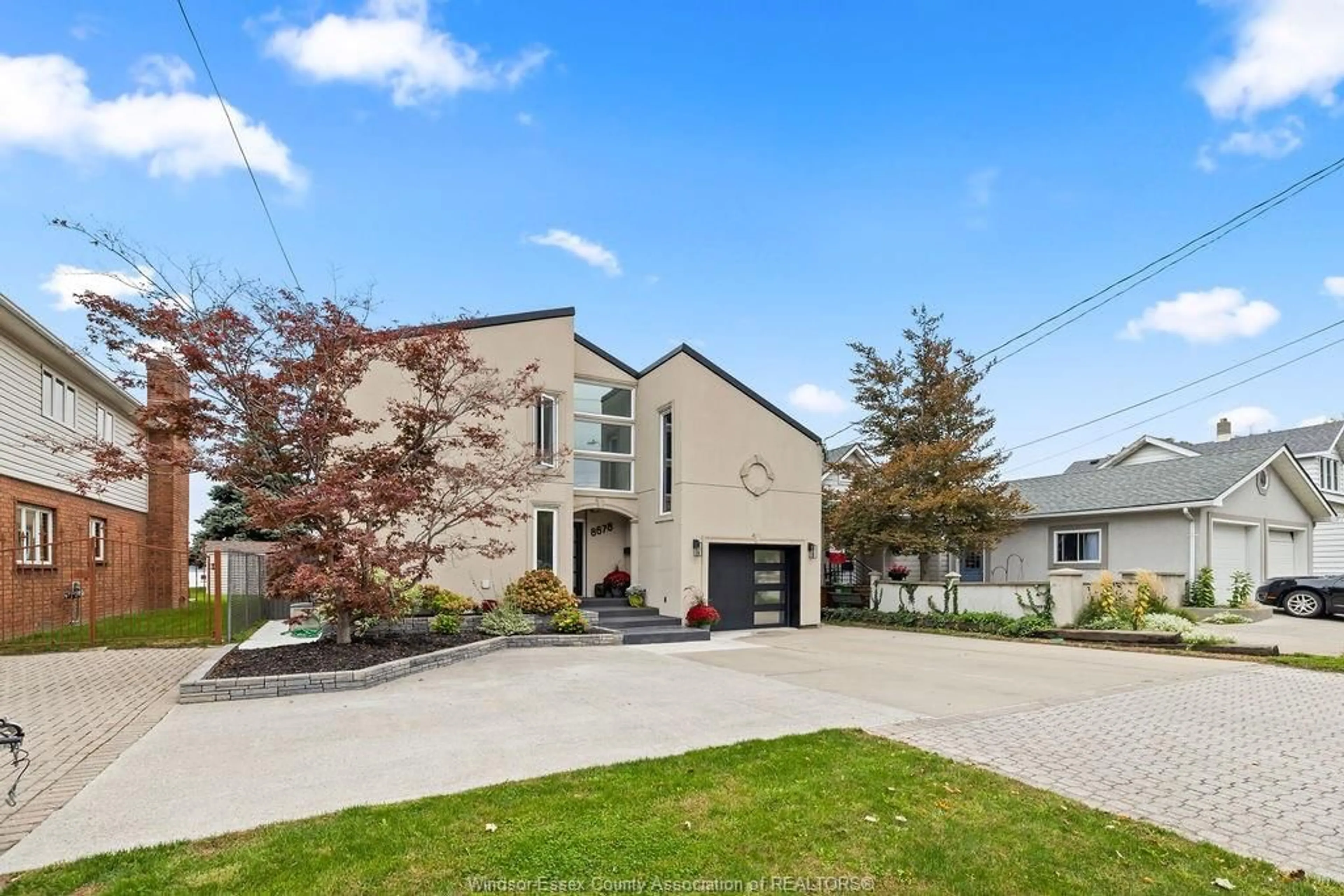 Home with brick exterior material, street for 8678 RIVERSIDE Dr, Windsor Ontario N8S 1E9