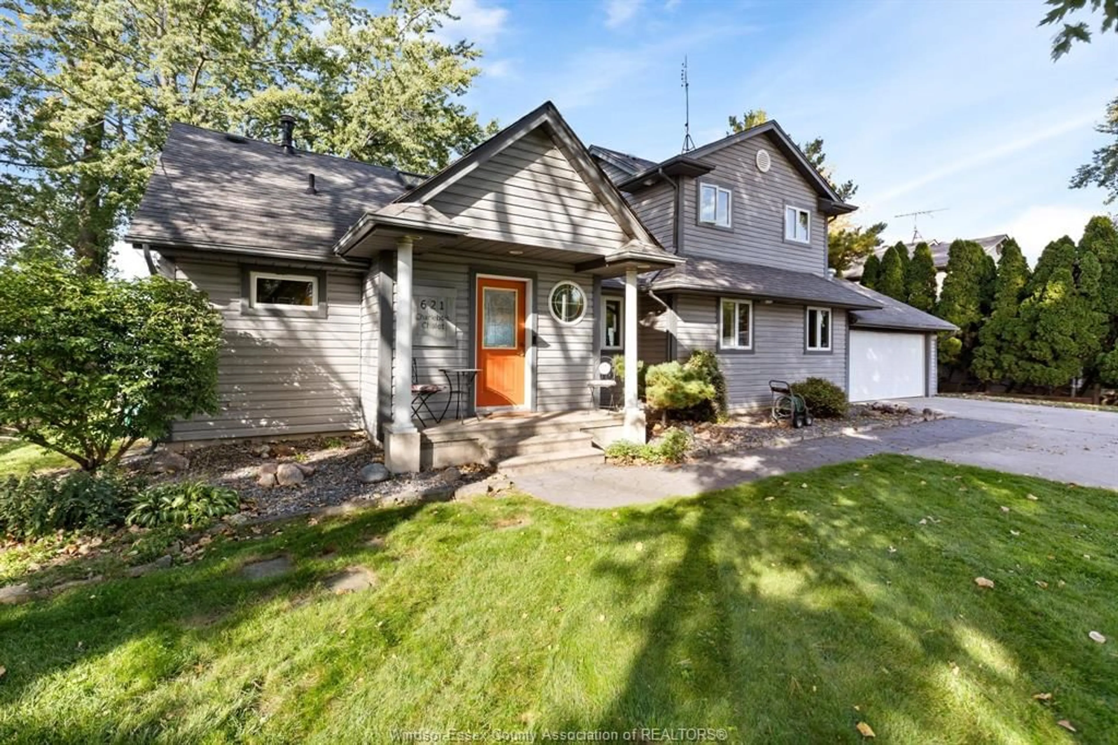 Home with vinyl exterior material, street for 621 Ross Beach Rd, Lakeshore Ontario N0R 1A0