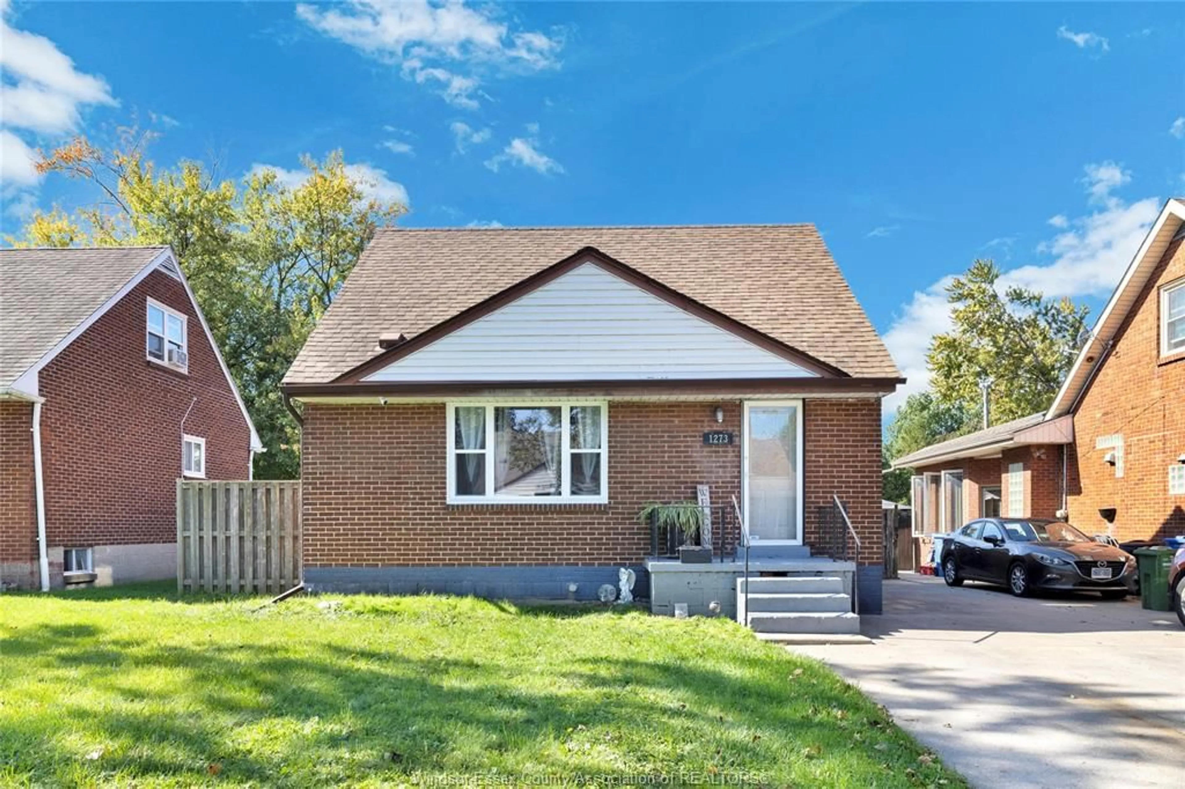 Home with brick exterior material, street for 1273 TILSTON Dr, Windsor Ontario N9B 3C6