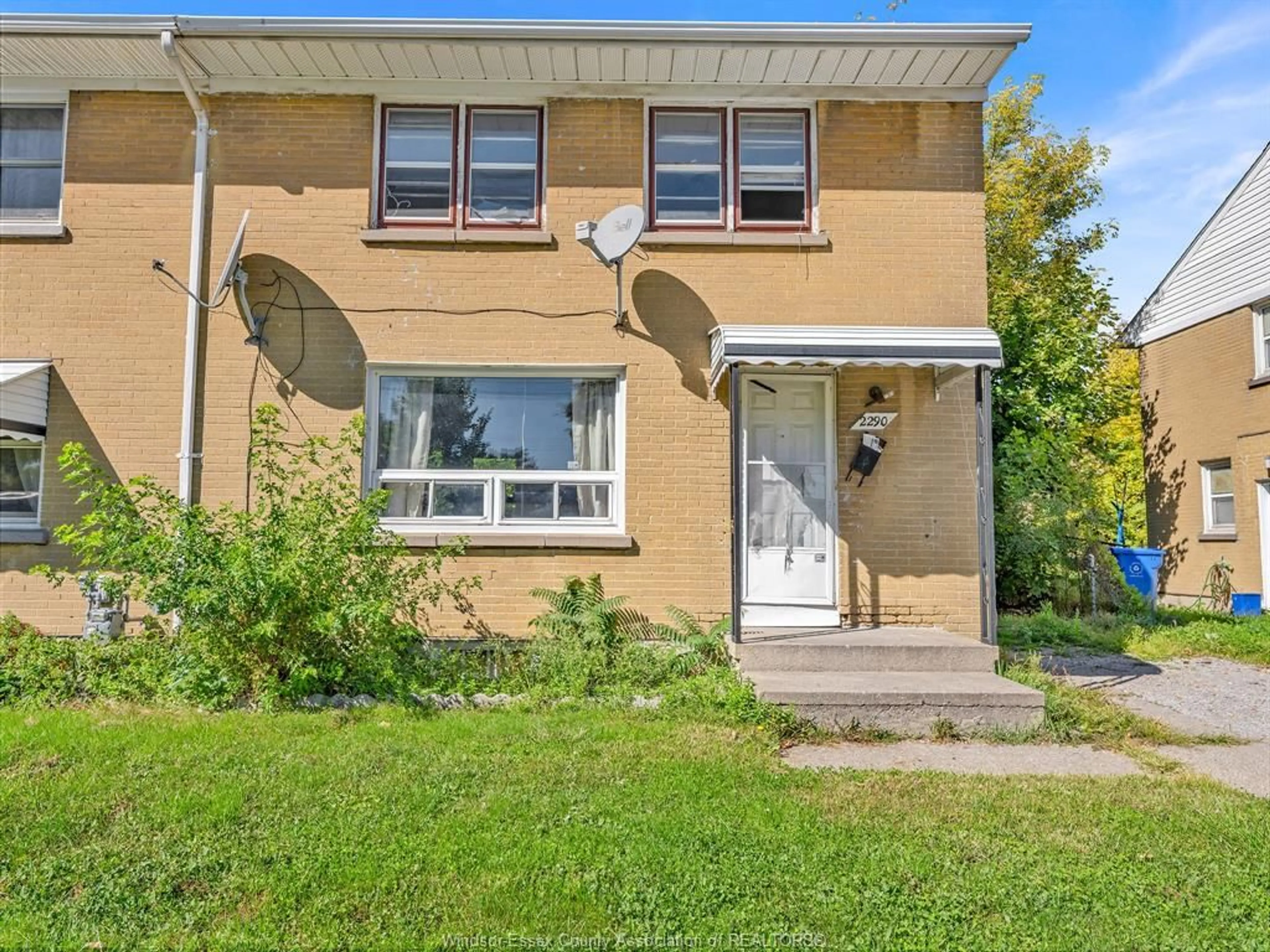 Home with vinyl exterior material, street for 2290 TECUMSEH Rd, Windsor Ontario N9B 1W1