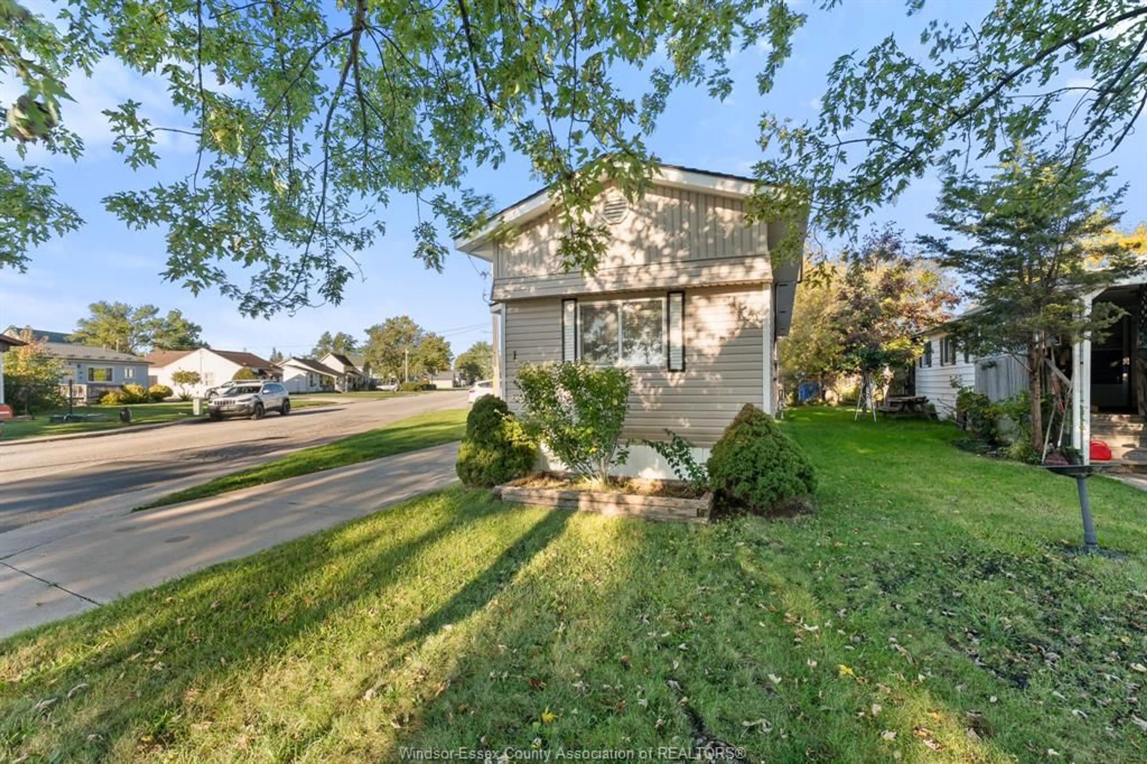 A pic from outside/outdoor area/front of a property/back of a property/a pic from drone, street for 1 Cedar Cres #101, McGregor Ontario N0R 1J0