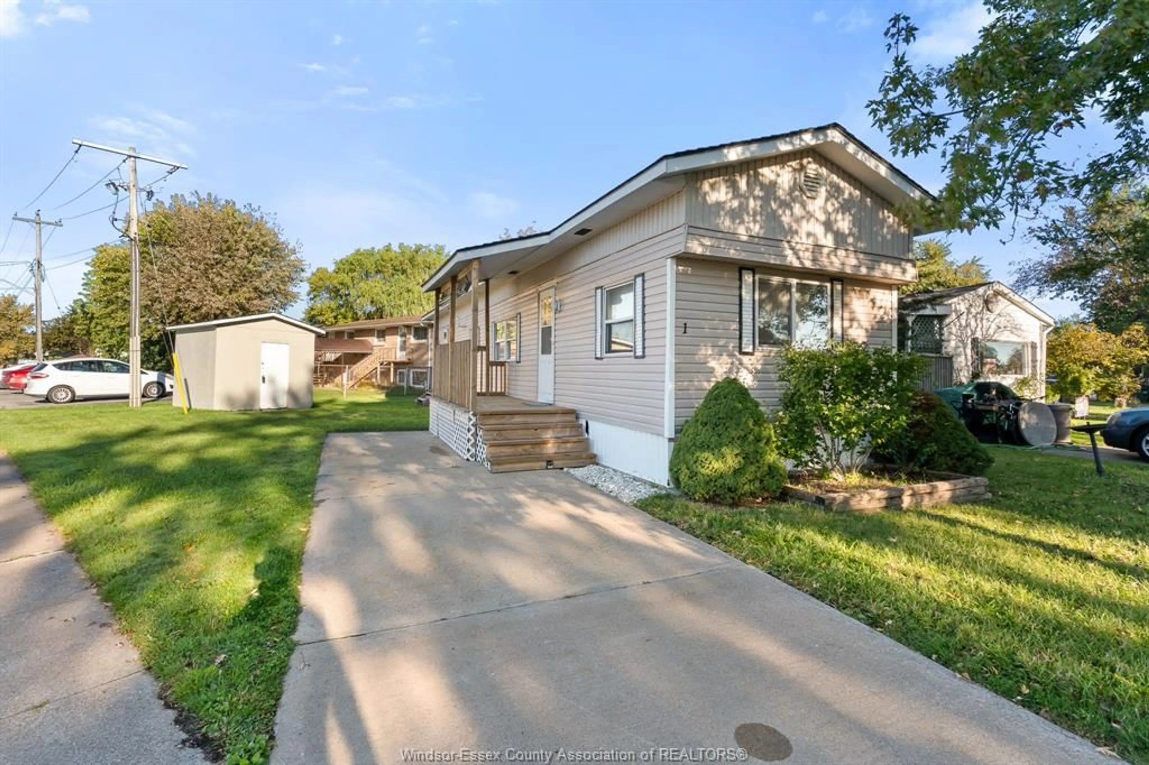 Home with vinyl exterior material, street for 1 Cedar Cres #101, McGregor Ontario N0R 1J0