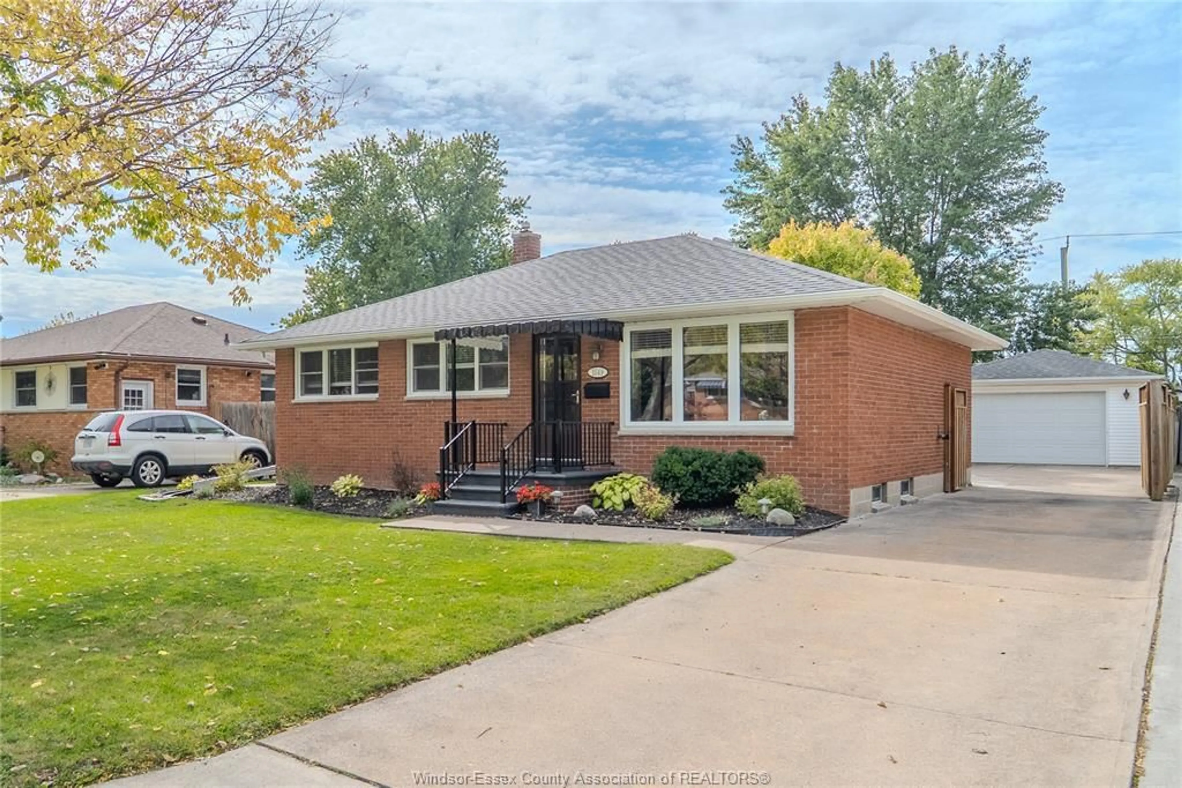 Home with brick exterior material, street for 1049 BUCKINGHAM Rd, Windsor Ontario N8S 2E2