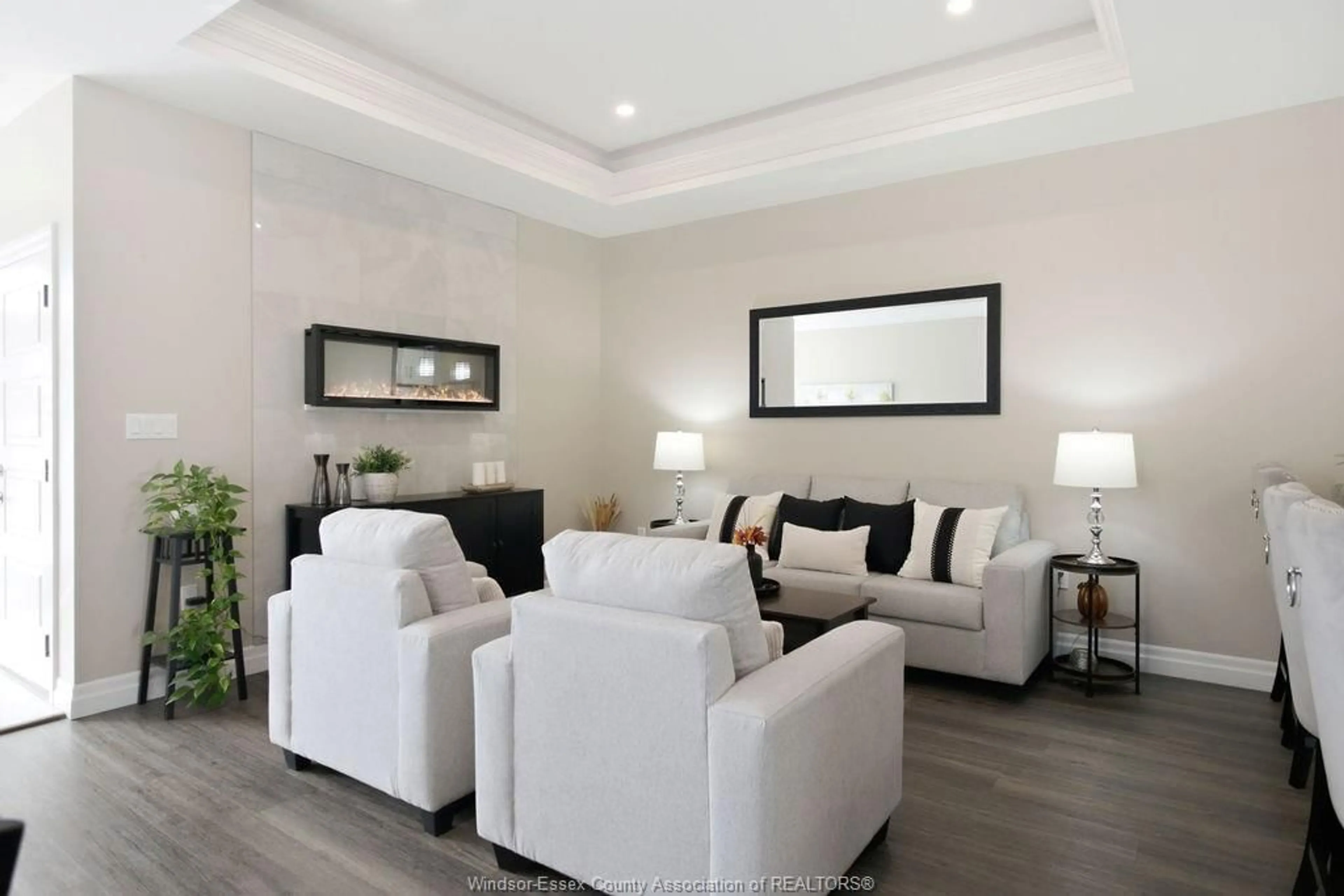 Living room with furniture, wood/laminate floor for 1948 ETHAN COURT, Windsor Ontario N8T 0B3