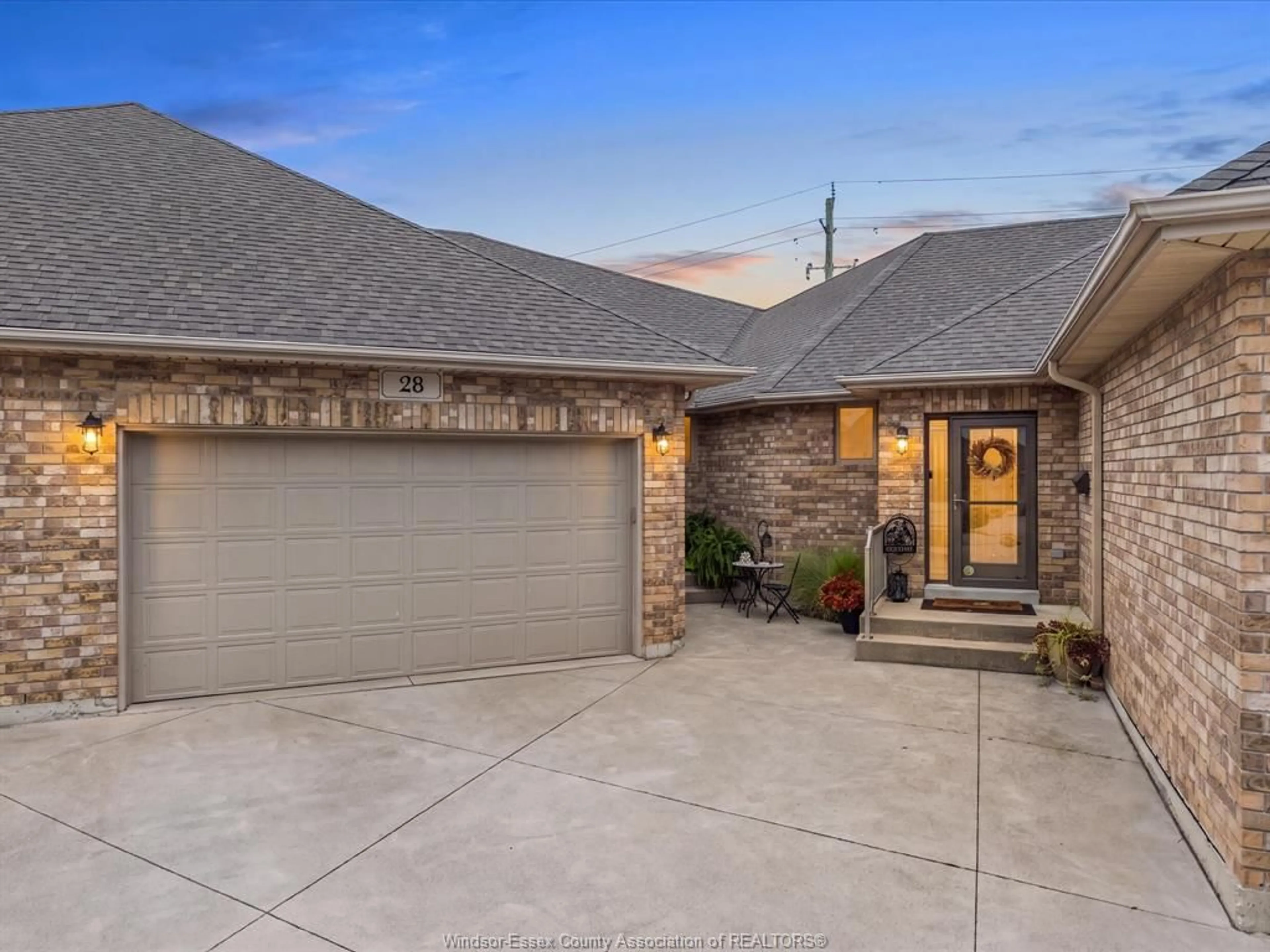 Home with brick exterior material, street for 28 Mettawas Lane, Kingsville Ontario N9Y 0A2