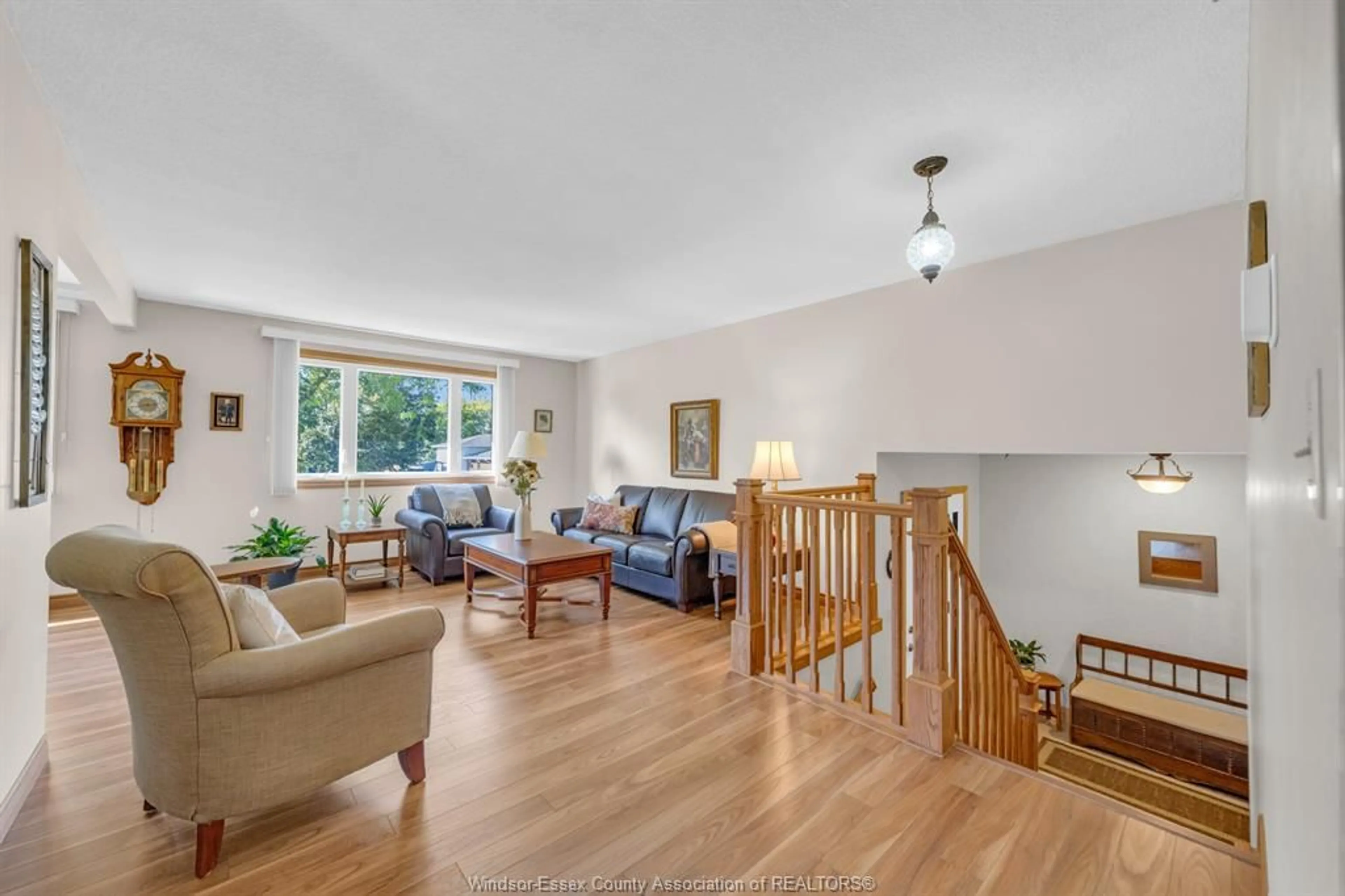Living room with furniture, wood/laminate floor for 8 Bruce Ave, Leamington Ontario N8H 4C3