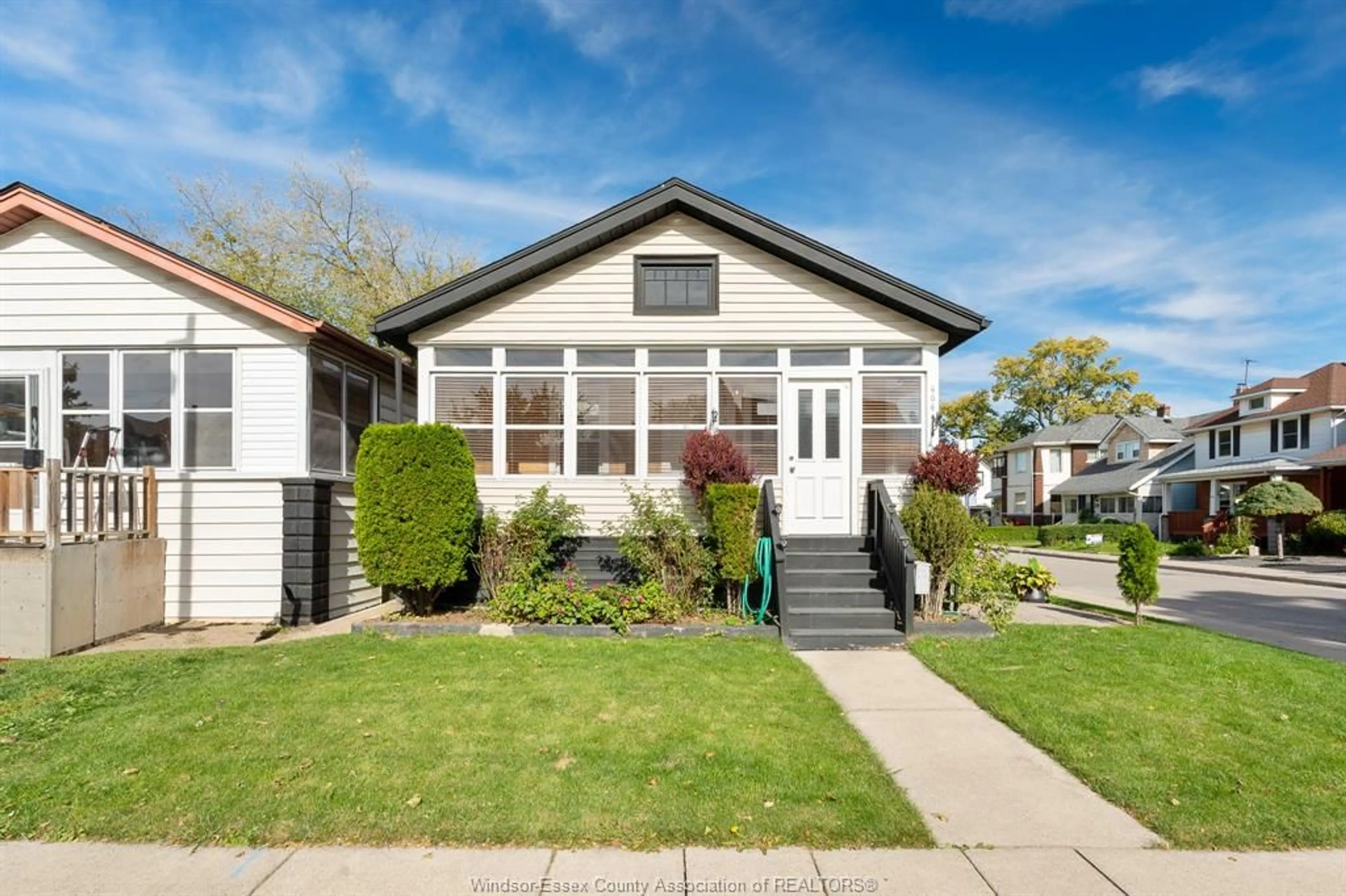 Home with vinyl exterior material, street for 404 CAROLINE St, Windsor Ontario N9A 6A6