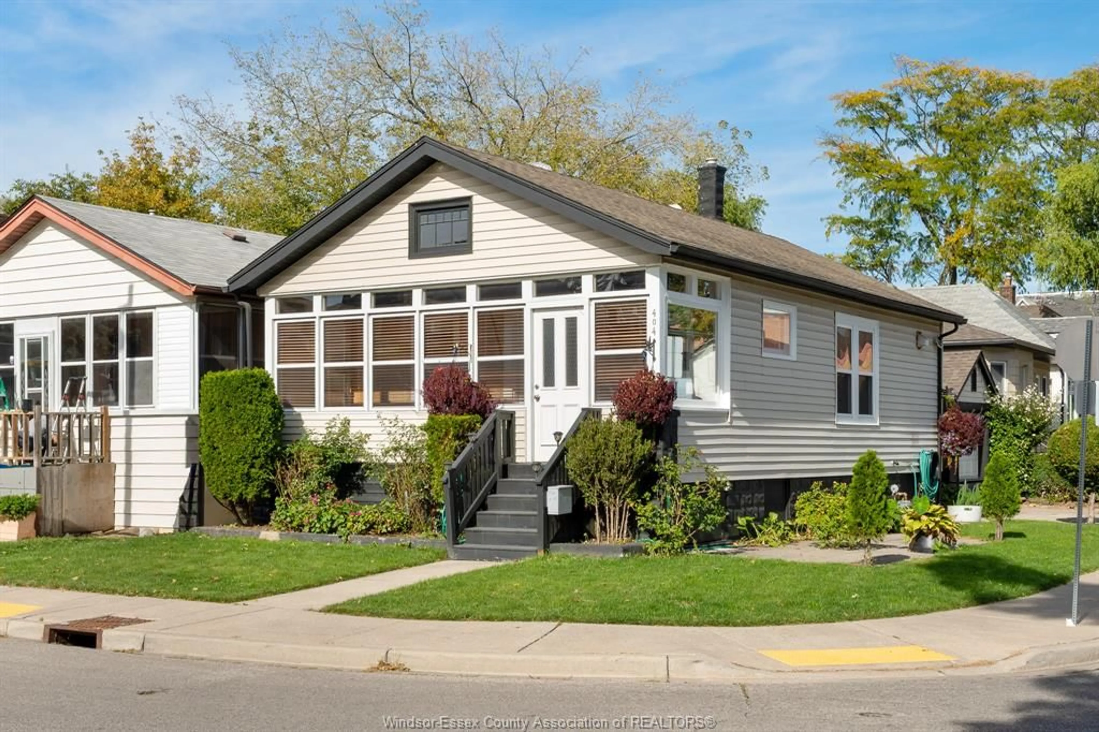 Home with vinyl exterior material, street for 404 CAROLINE St, Windsor Ontario N9A 6A6