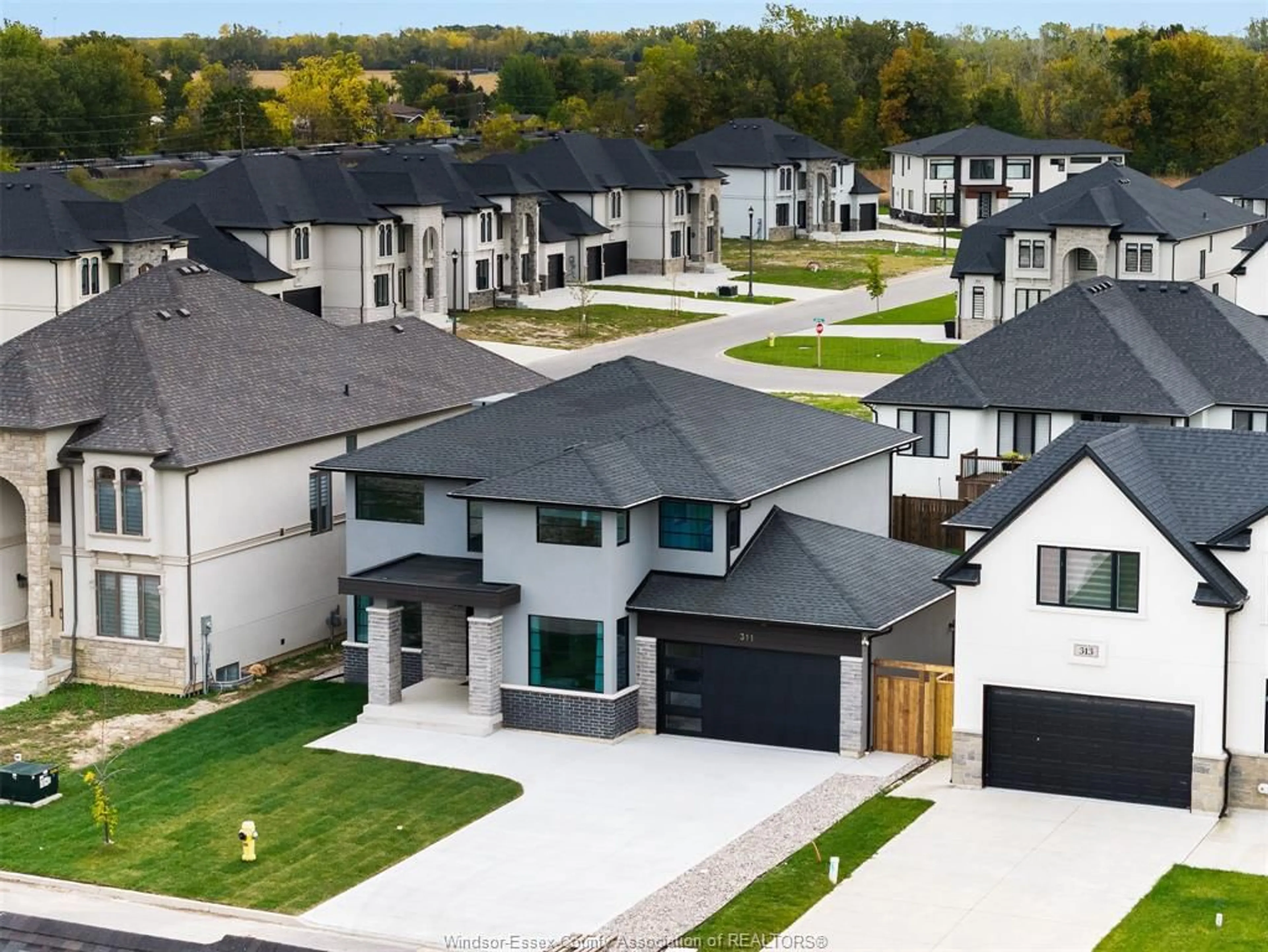 A pic from outside/outdoor area/front of a property/back of a property/a pic from drone, street for 311 BENSON Crt, Amherstburg Ontario N9V 0G7