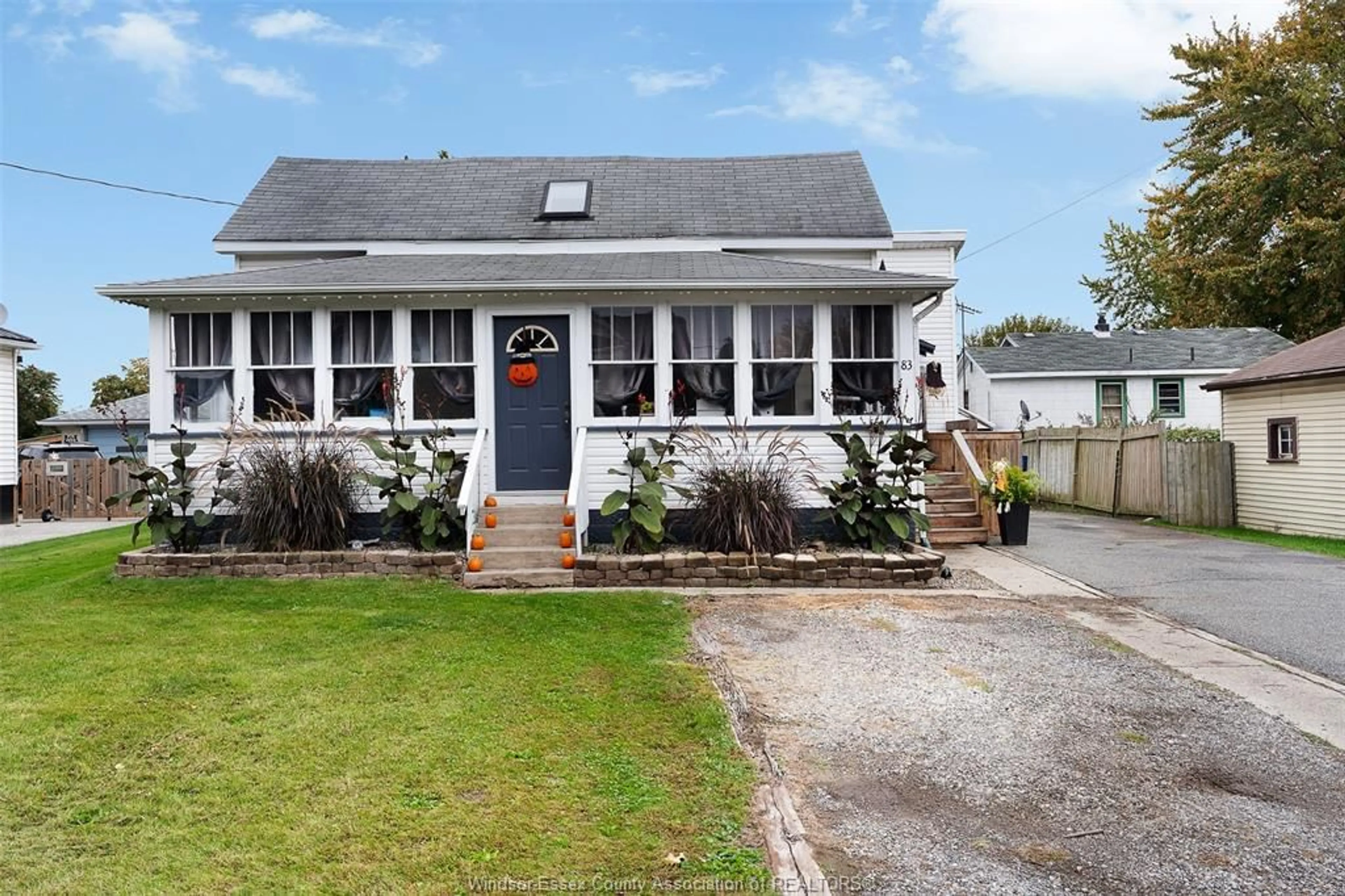 Home with vinyl exterior material, street for 83 Elliott St, Leamington Ontario N8H 3M9
